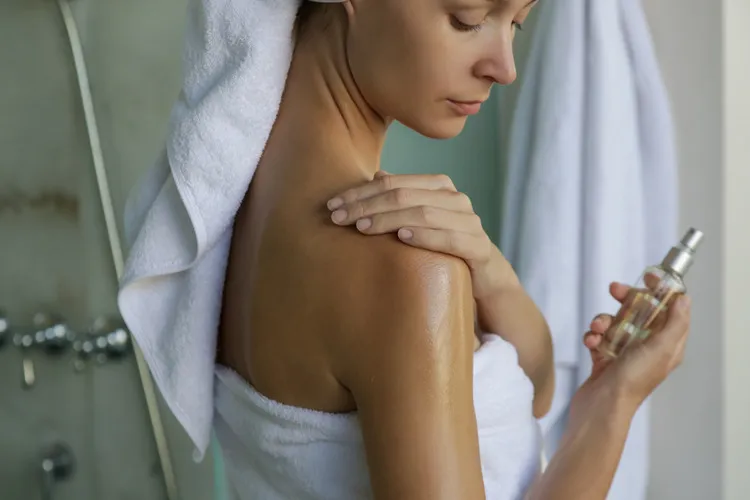 Women rubbing Hemp Seed oil onto her skin