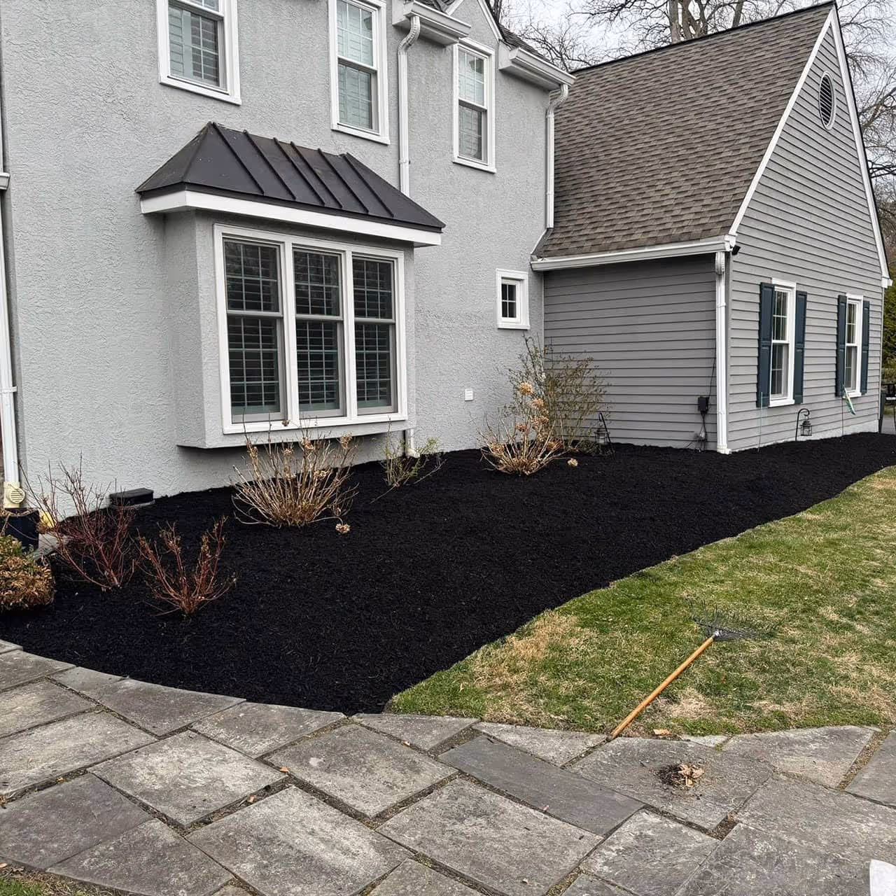 Fresh mulch in front of home  by Morrisroe Landscaping for great landscaping in Delaware County.