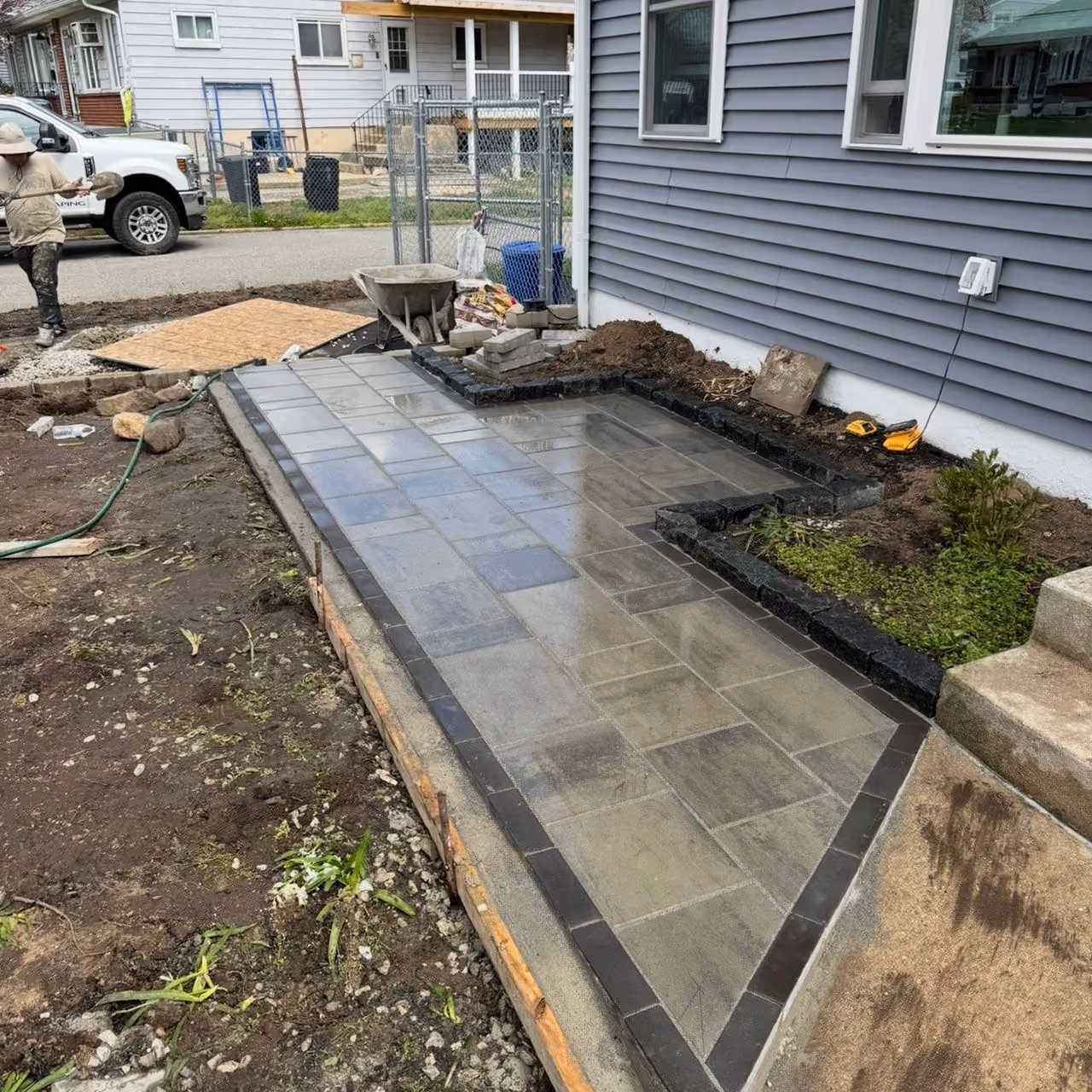 Custom paver patio installation by Morrisroe Landscaping