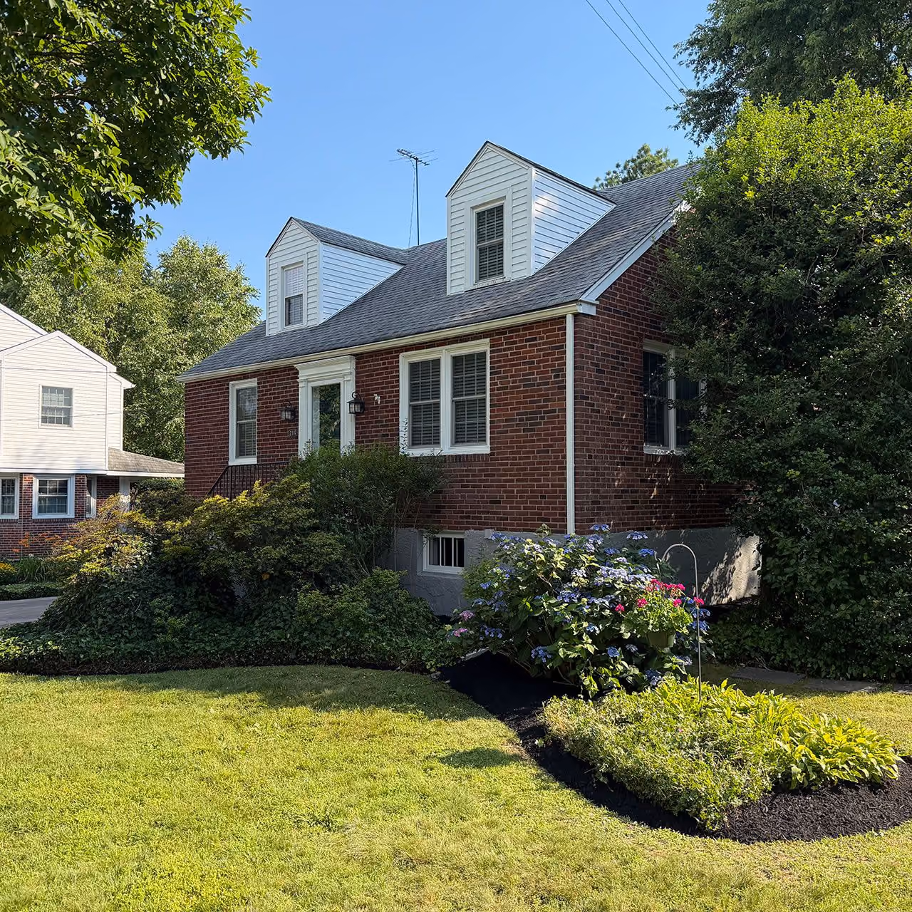 Shrub pruning and landscape maintenance by Morrisroe Landscaping