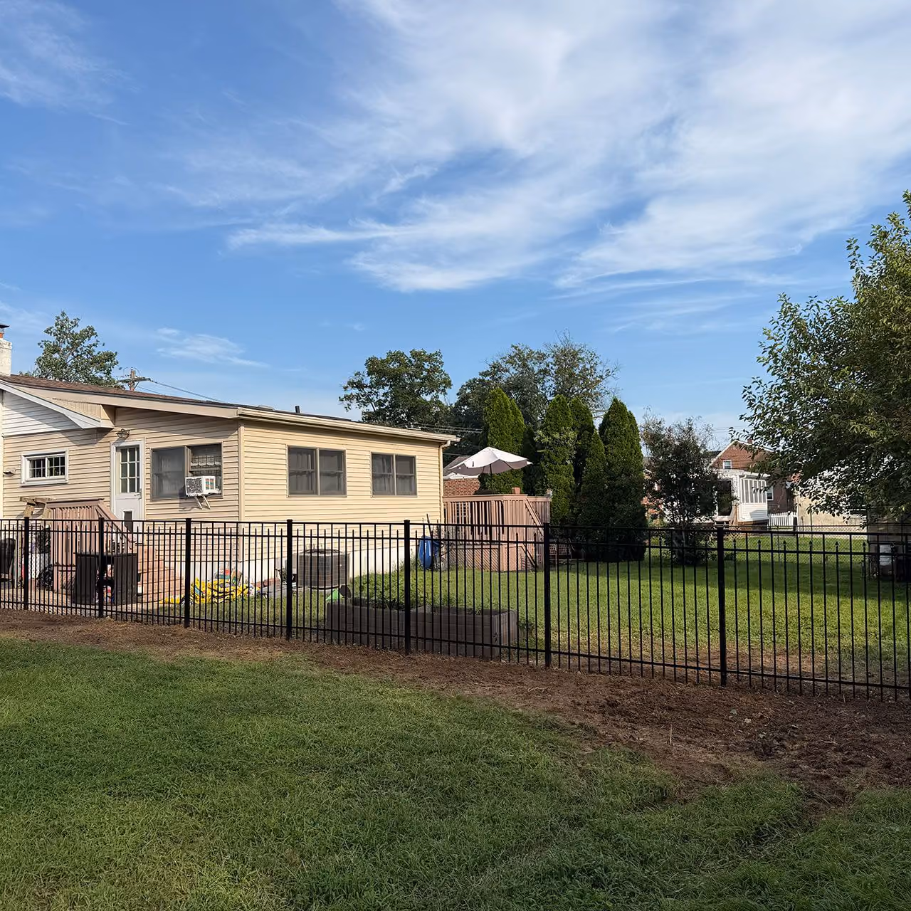 Professional fence installation by Morrisroe Landscaping for durable and attractive residential fencing near me