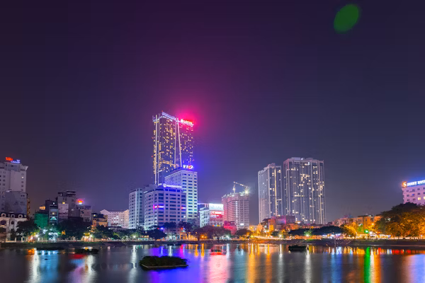 An urban cityscape in Vietnam at night.
