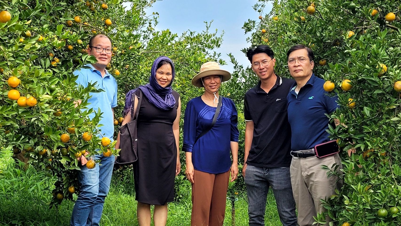 Techcoop employees on a farm.