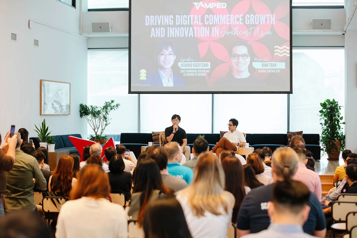 Binh Tran moderating a talk.