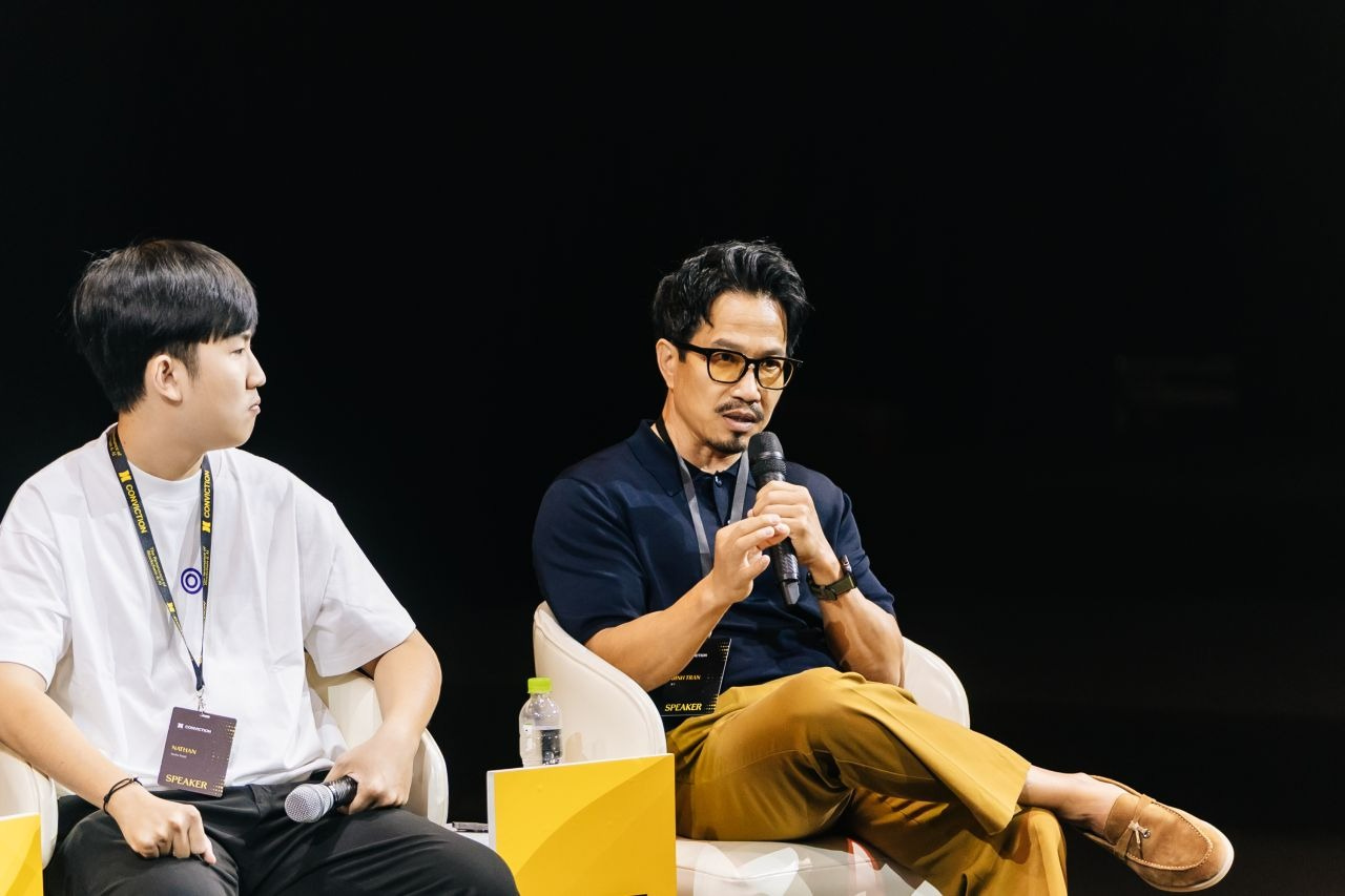 Binh Tran speaking at an event.