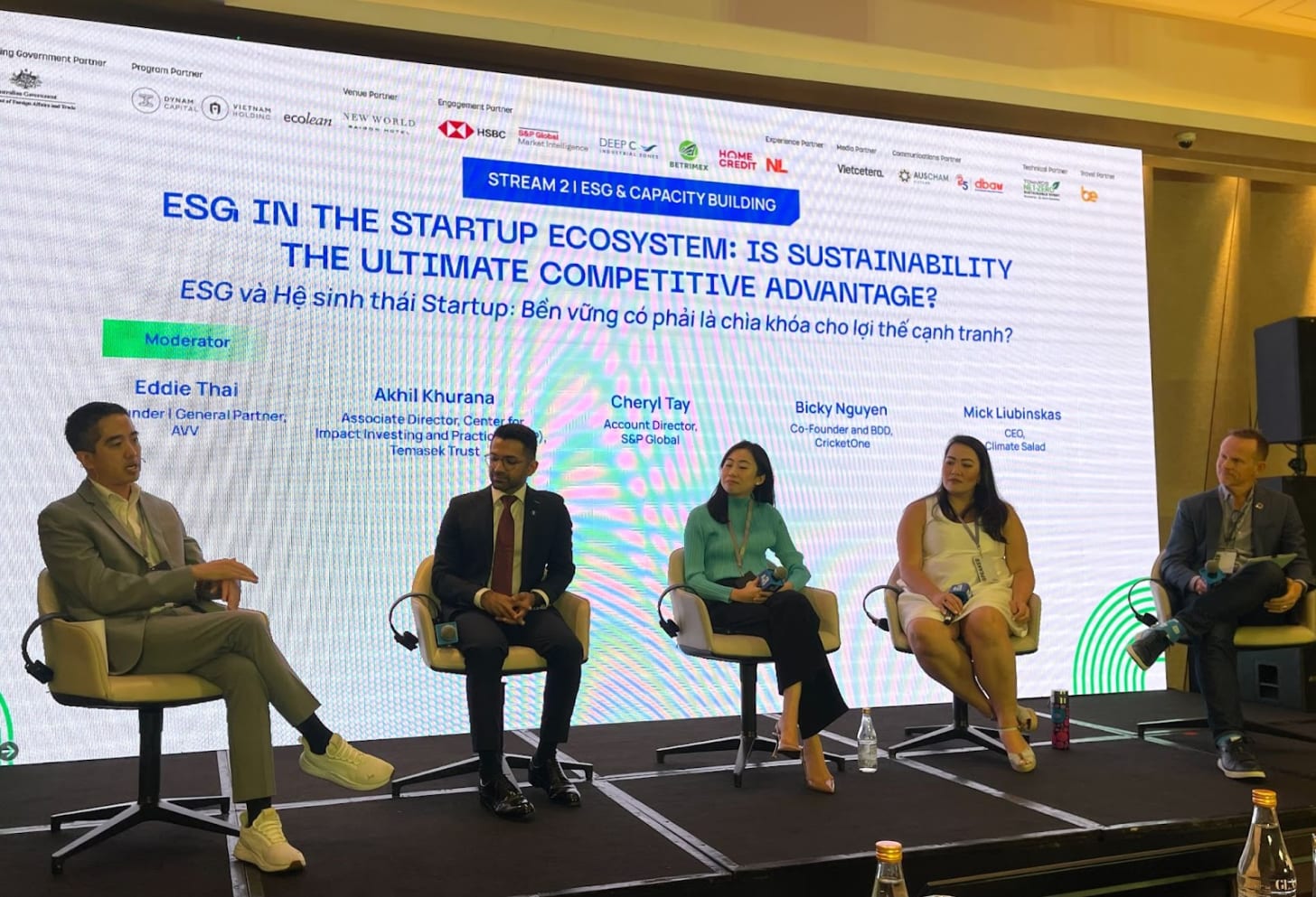 Eddie Thai moderating a panel discussion.