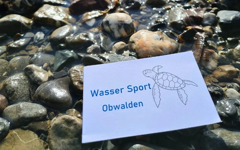Visitenkarte von Wasser Sport Obwalden mit Stein Hintergrund