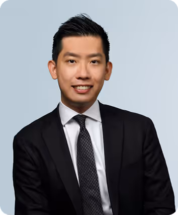 Portrait of Johnny Kong, principal migration lawyer at Riverwood Migration