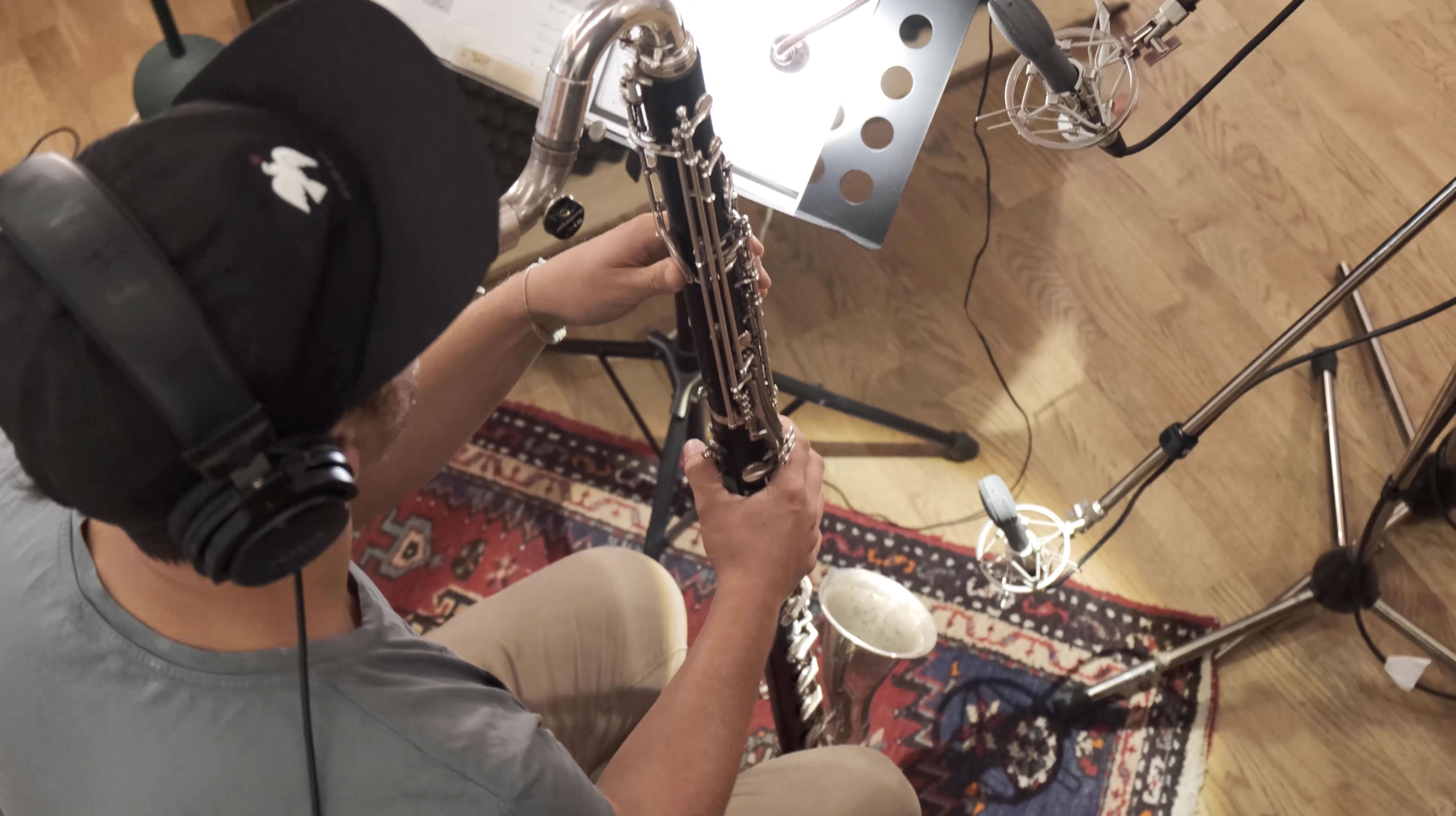 An insight into a person playing an instrument in the studios of why do birds in Berlin.