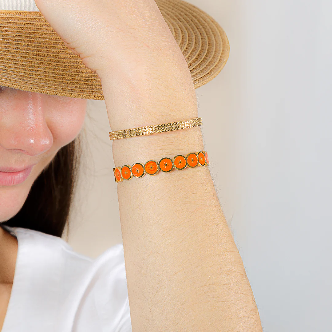 Orange gold bangle: a trendy summer 2026 accessory