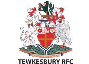 Tewkesbury RFC coat of arms with a red and gold shield, a leopard on the left, an eagle on the right, a castle, flowers, a green dragon on top, and a banner reading 'In Consilio Sapientia'.