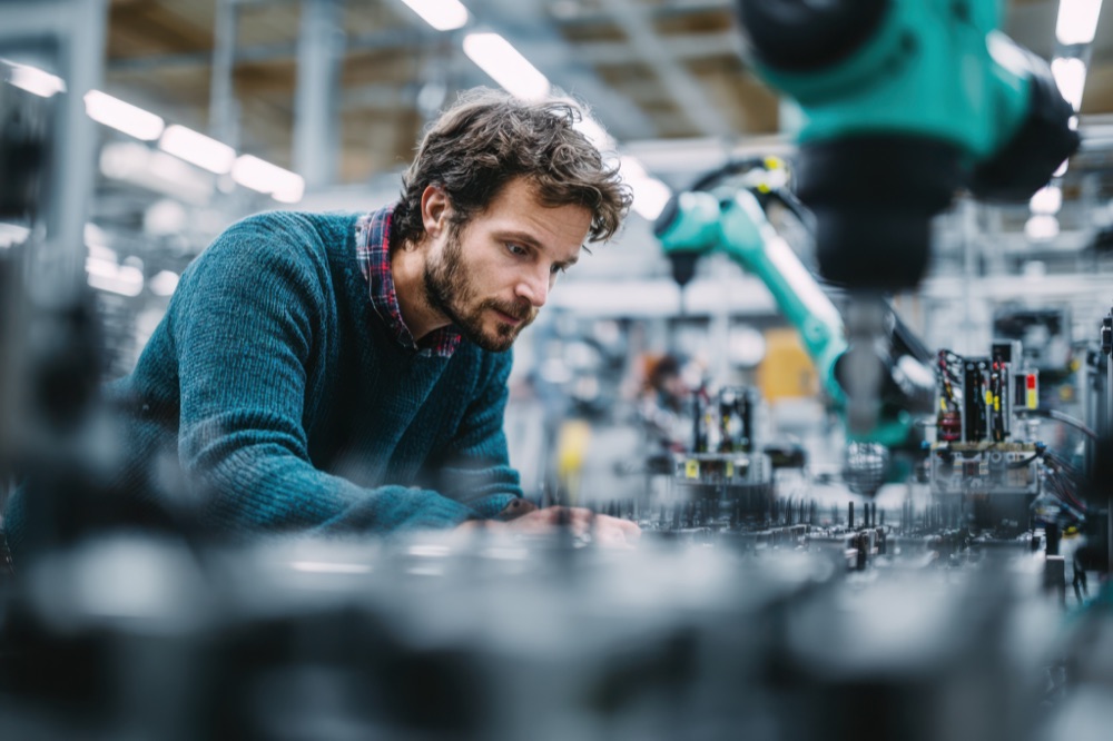 Engineer working at an automated production line