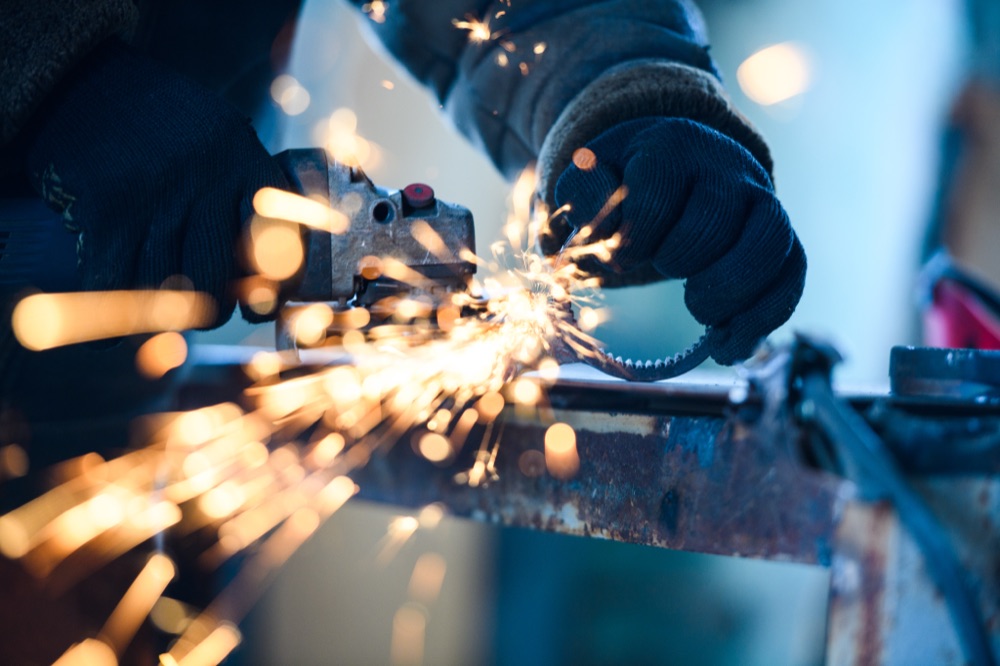 Sparks flying from an angle grinder cutting metal
