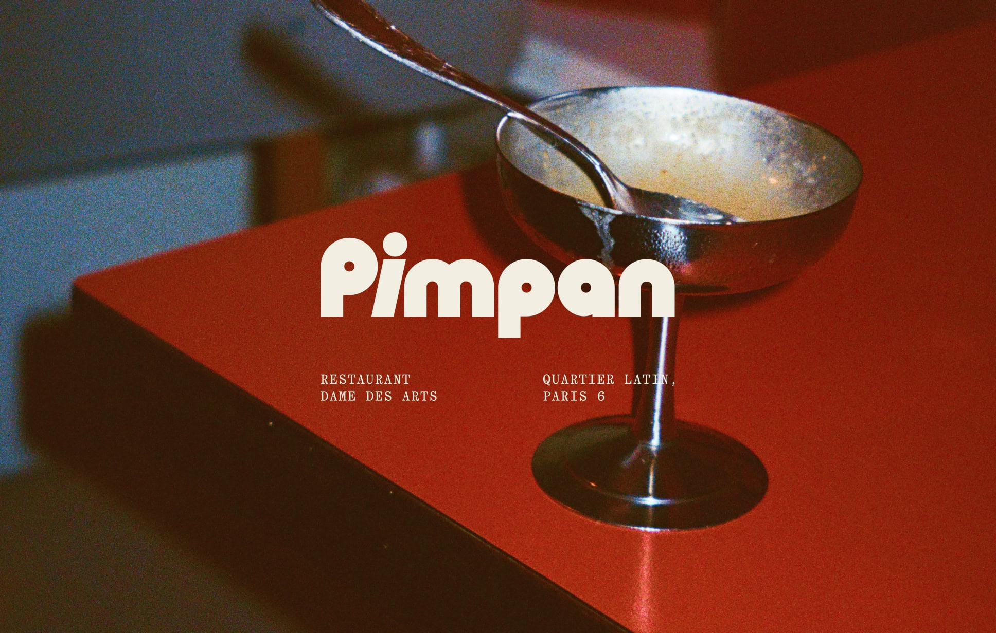 Logotype on a red restaurant table for Pimpan restaurant in Dame des Arts Hotel in Paris