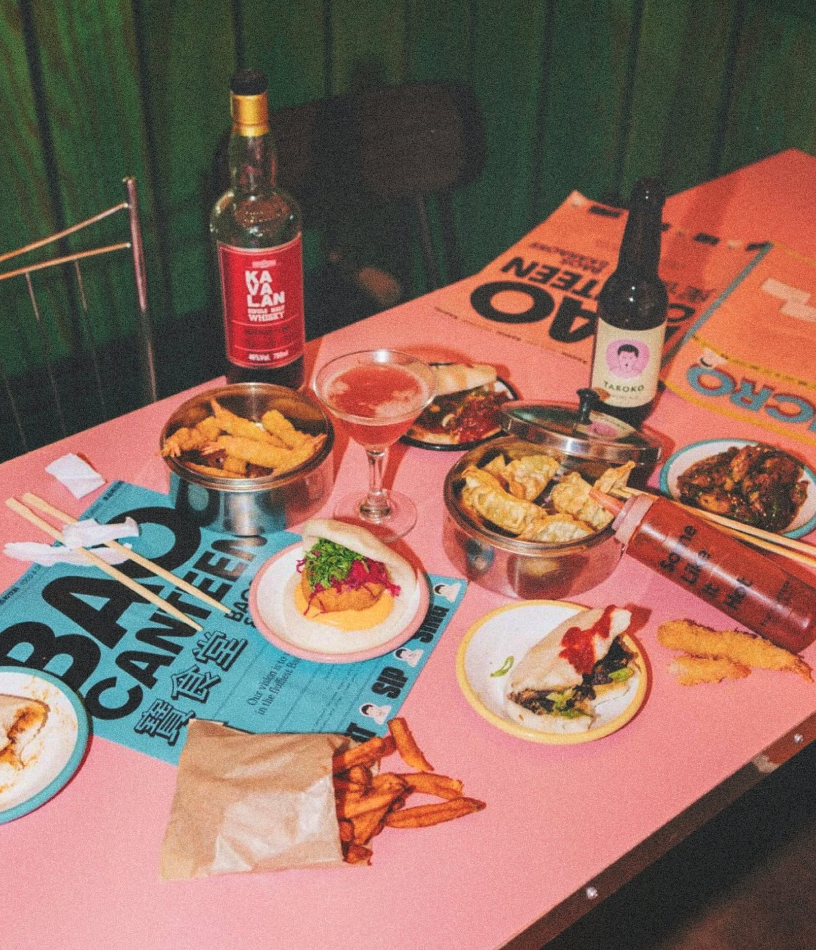 Restaurant table with food and menu design for Bao Canteen, a Taiwanese bao and karaoke restaurant