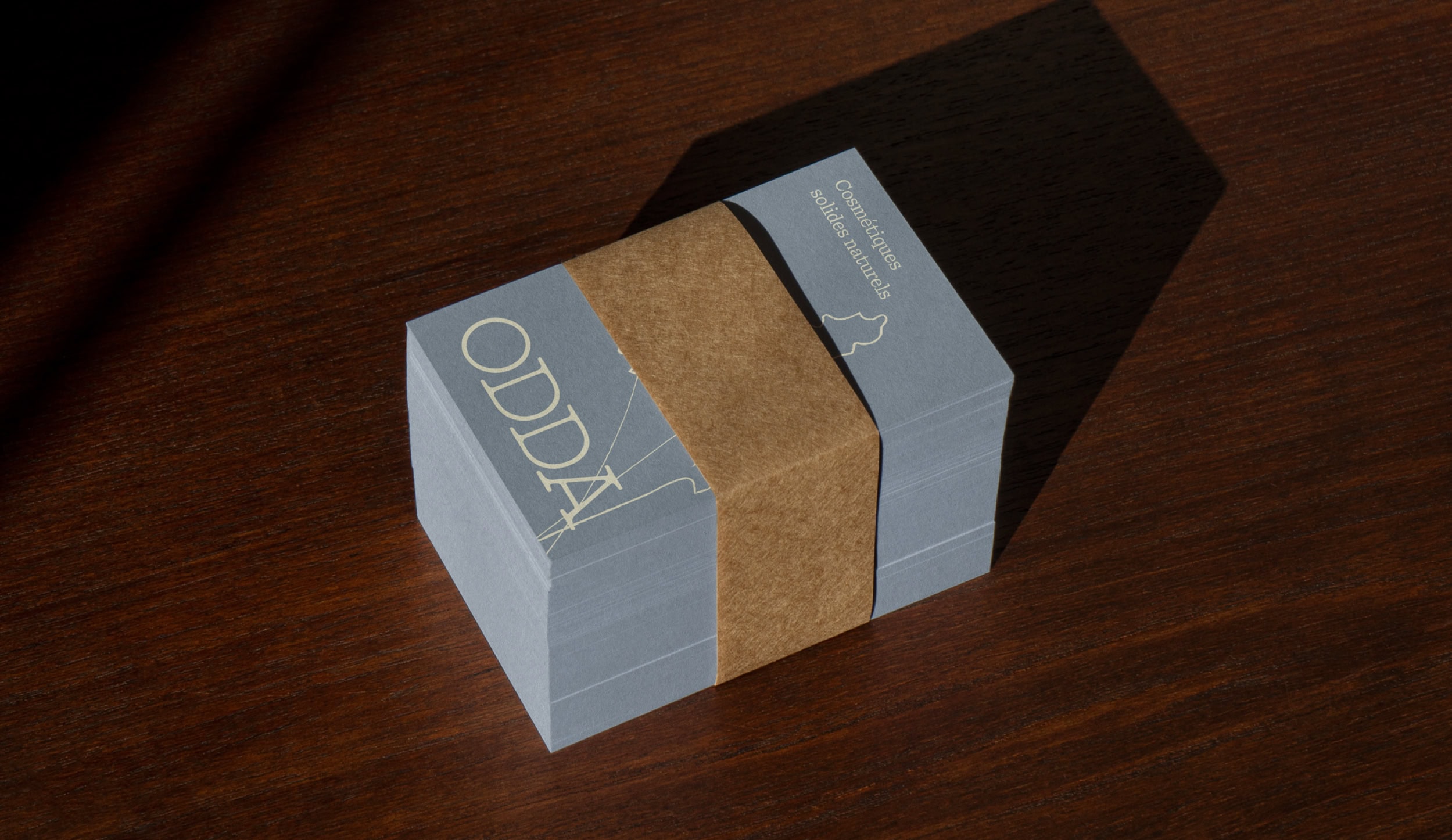 Business card design for Odda Cosmetics, a natural beauty brand