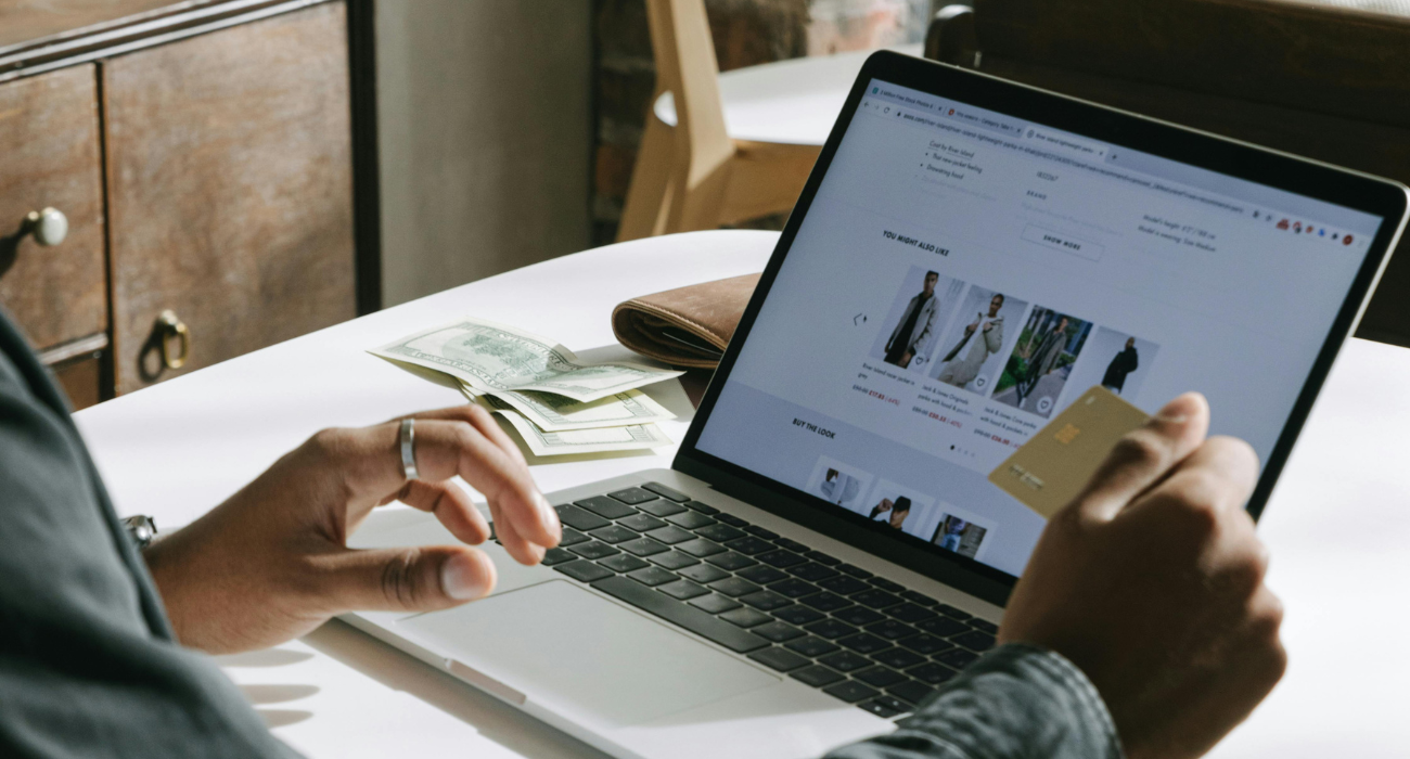 Customer shopping on an e-commerce website using laptop and credit card, illustrating online store marketing and conversions in 2026