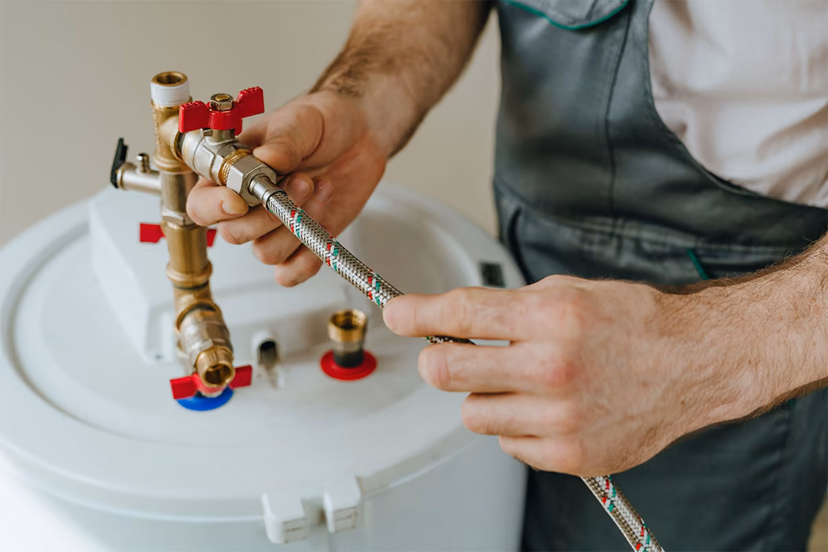 Professional water heater repair is in progress.