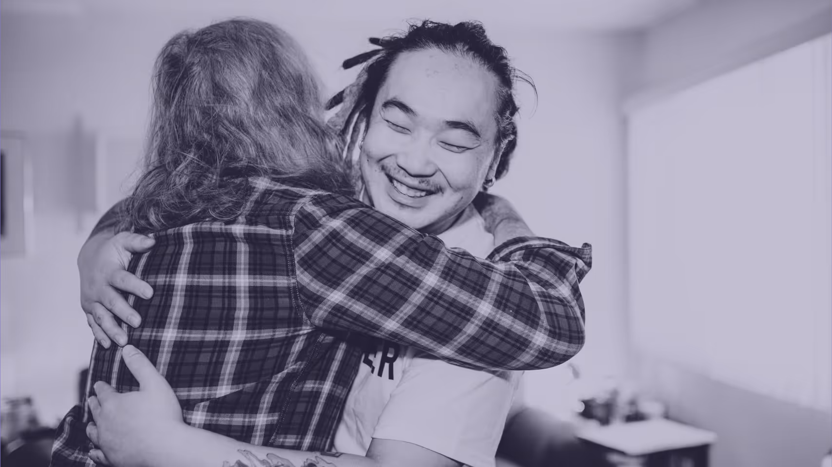 a person hugging another person