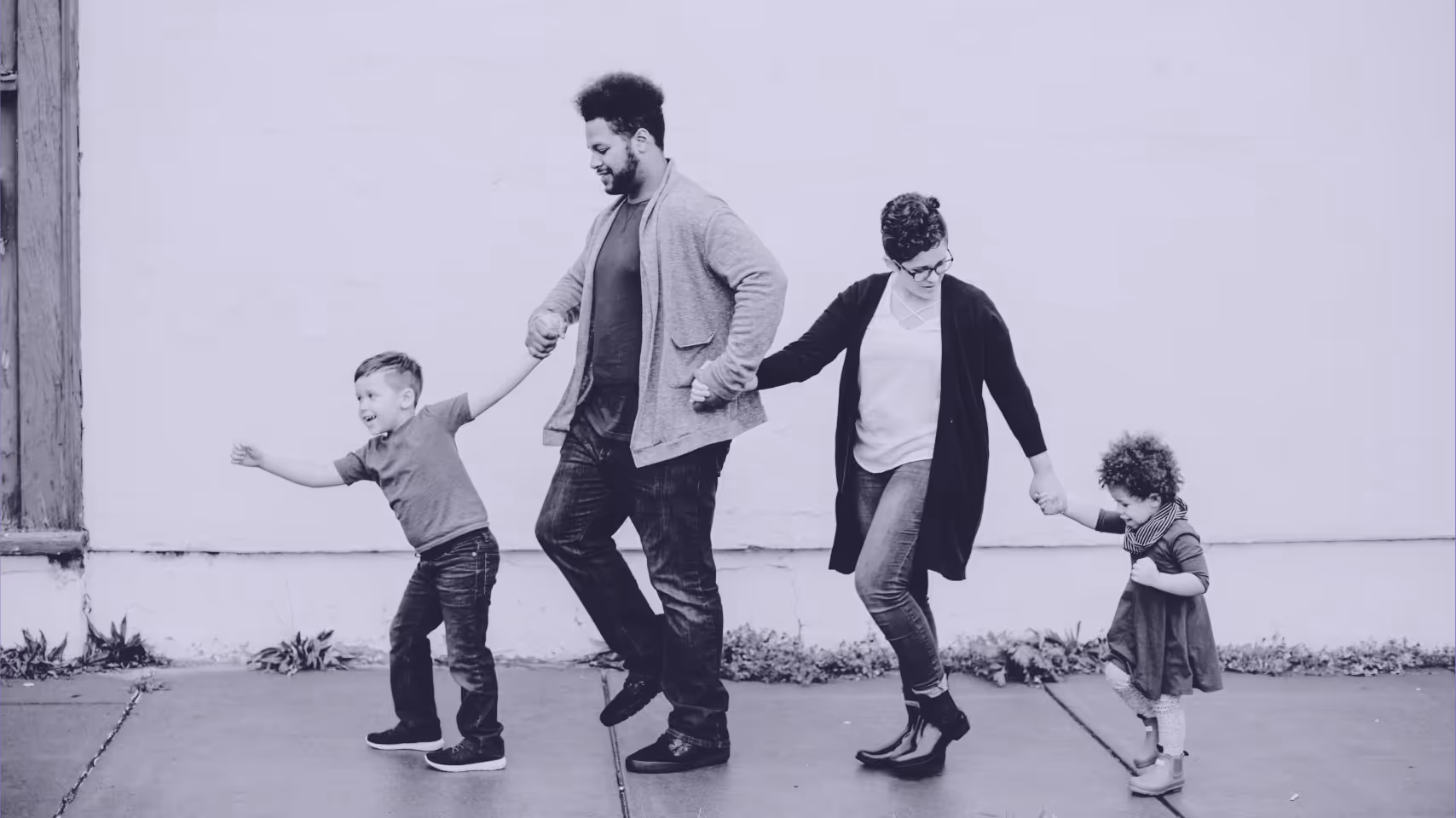 a photo of a family holding hands