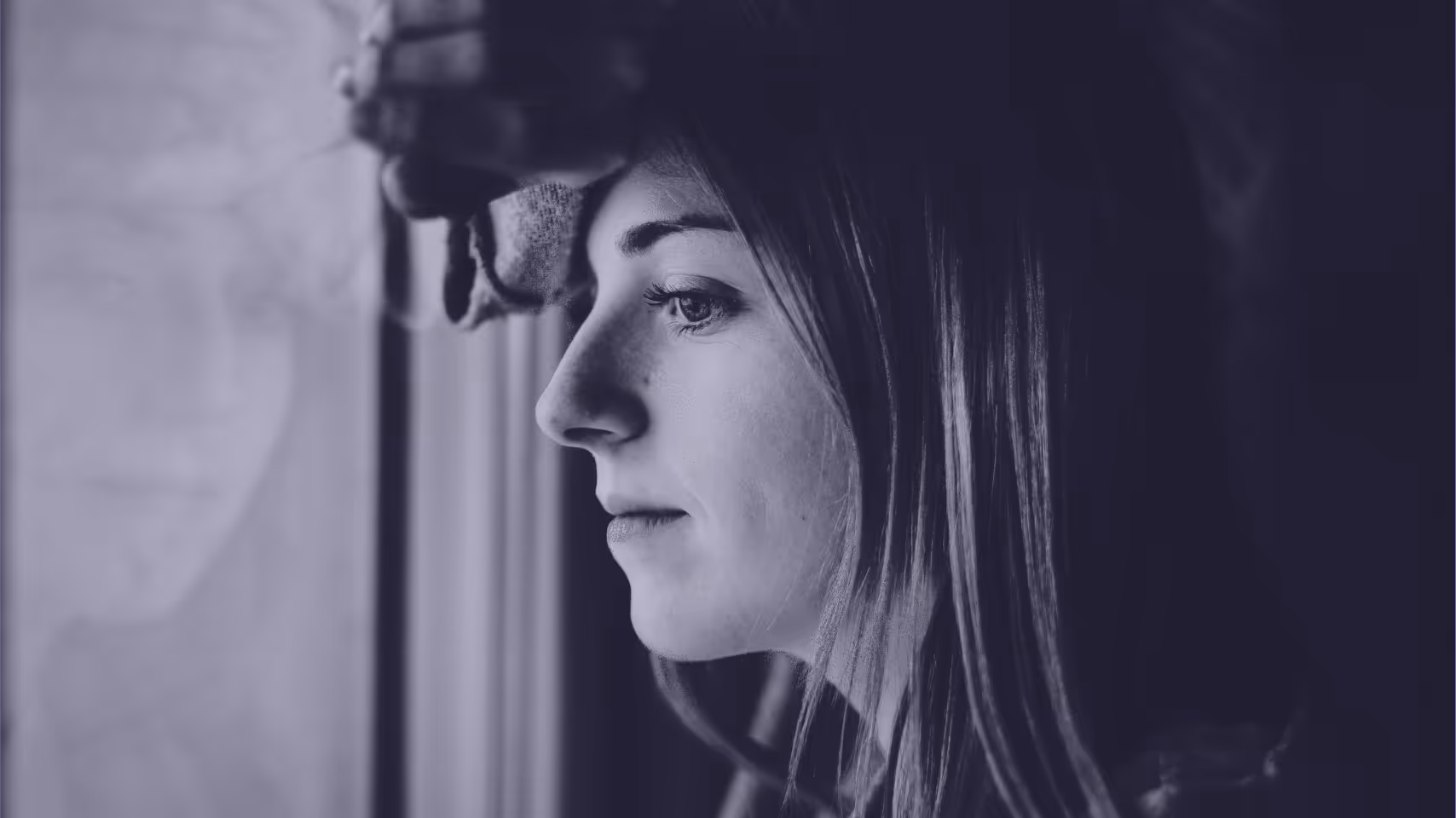 a person looking out the window