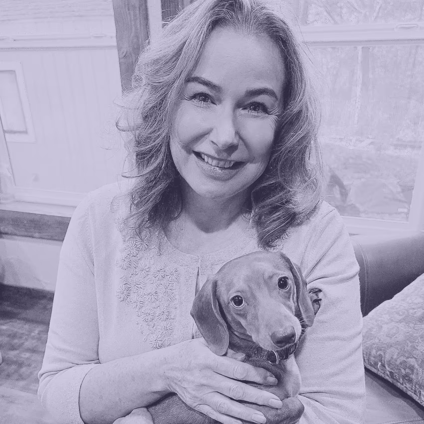 A photo of a person and dog