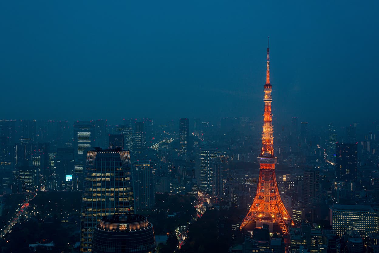 Business park Roppongi Hills sky deck during a hazy evening surrounded by its neighboring skyscrapers.
