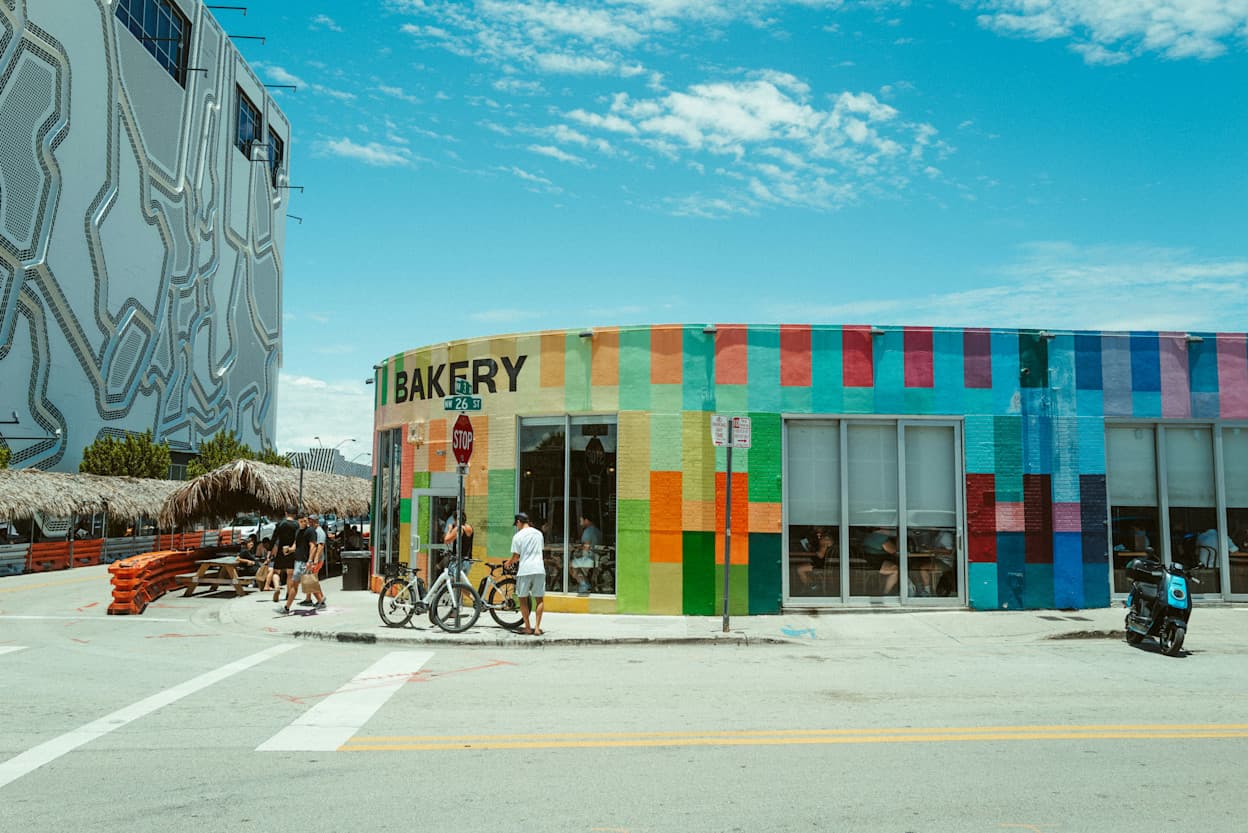 Rainbow colored walls in Wynwood during a sunny afternoon.