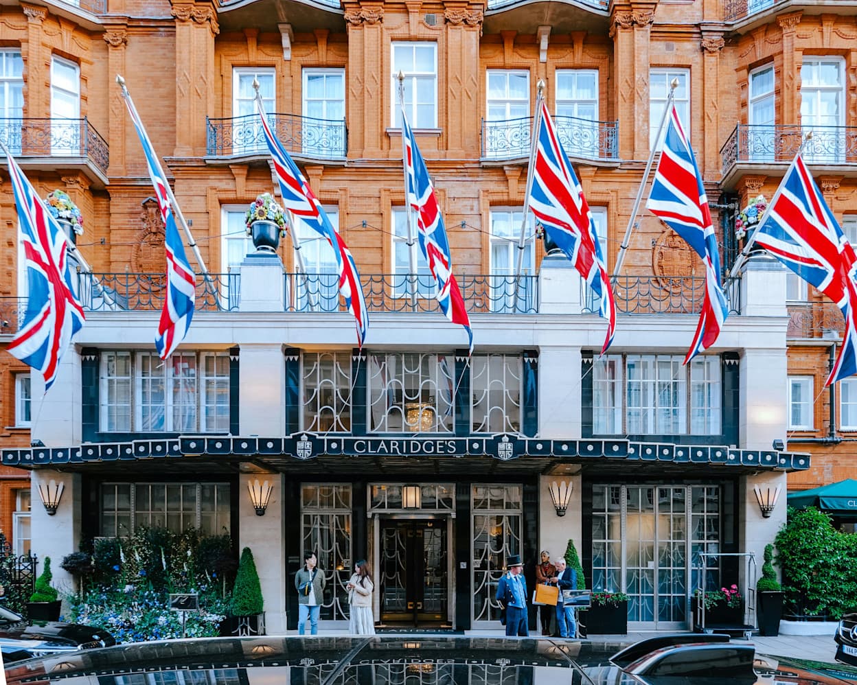 Street view of hotel in Mayfair, London with the UK flag above the entrance