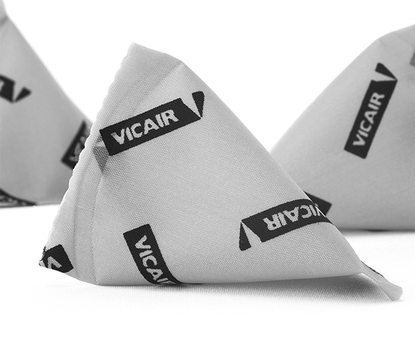 Close-up of gray triangular fabric pouches labeled with 'VICAIR' in black text.