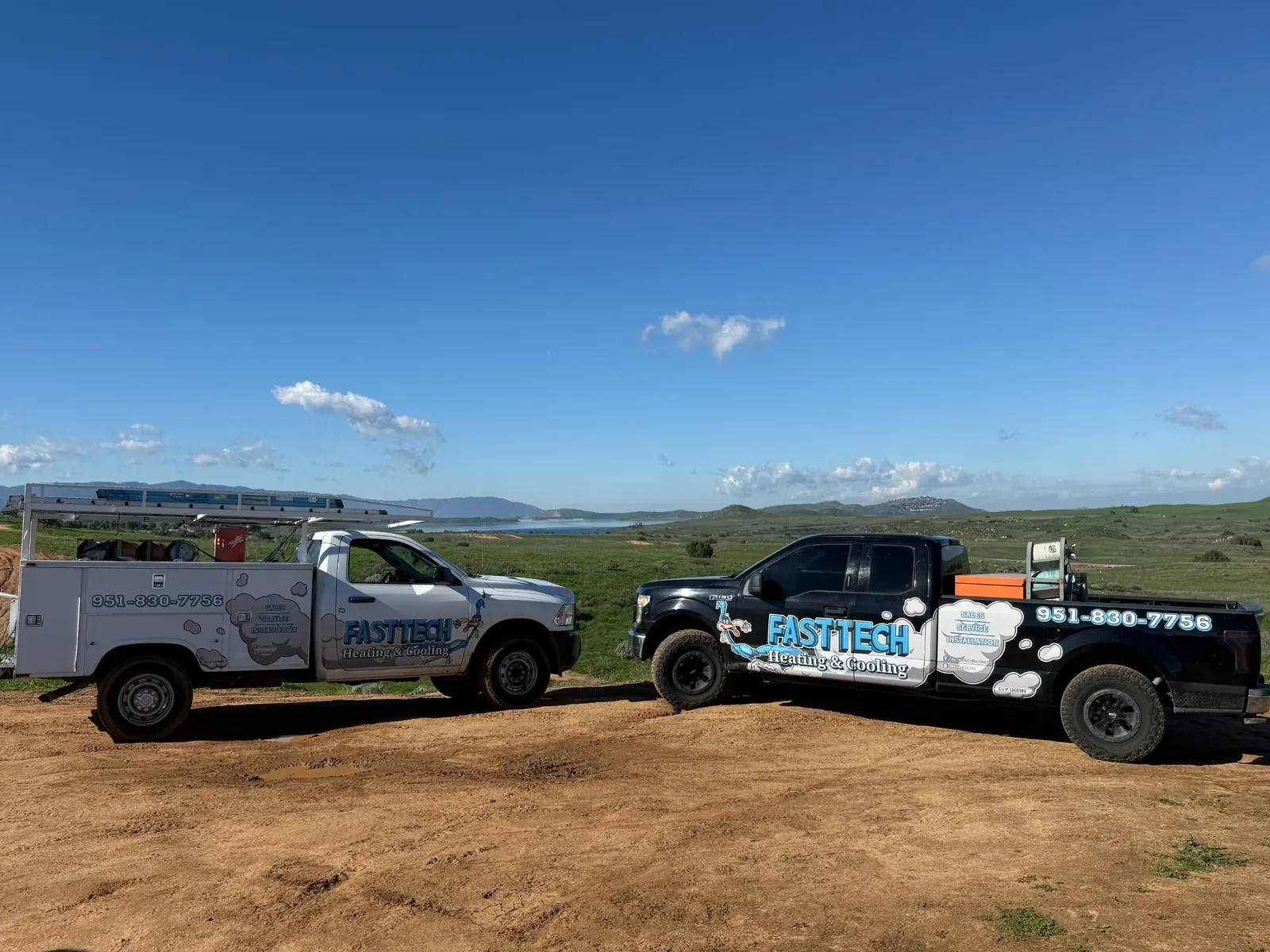 Fast Tech Heating & Cooling service trucks parked on location, representing professional HVAC services in Riverside County, CA.