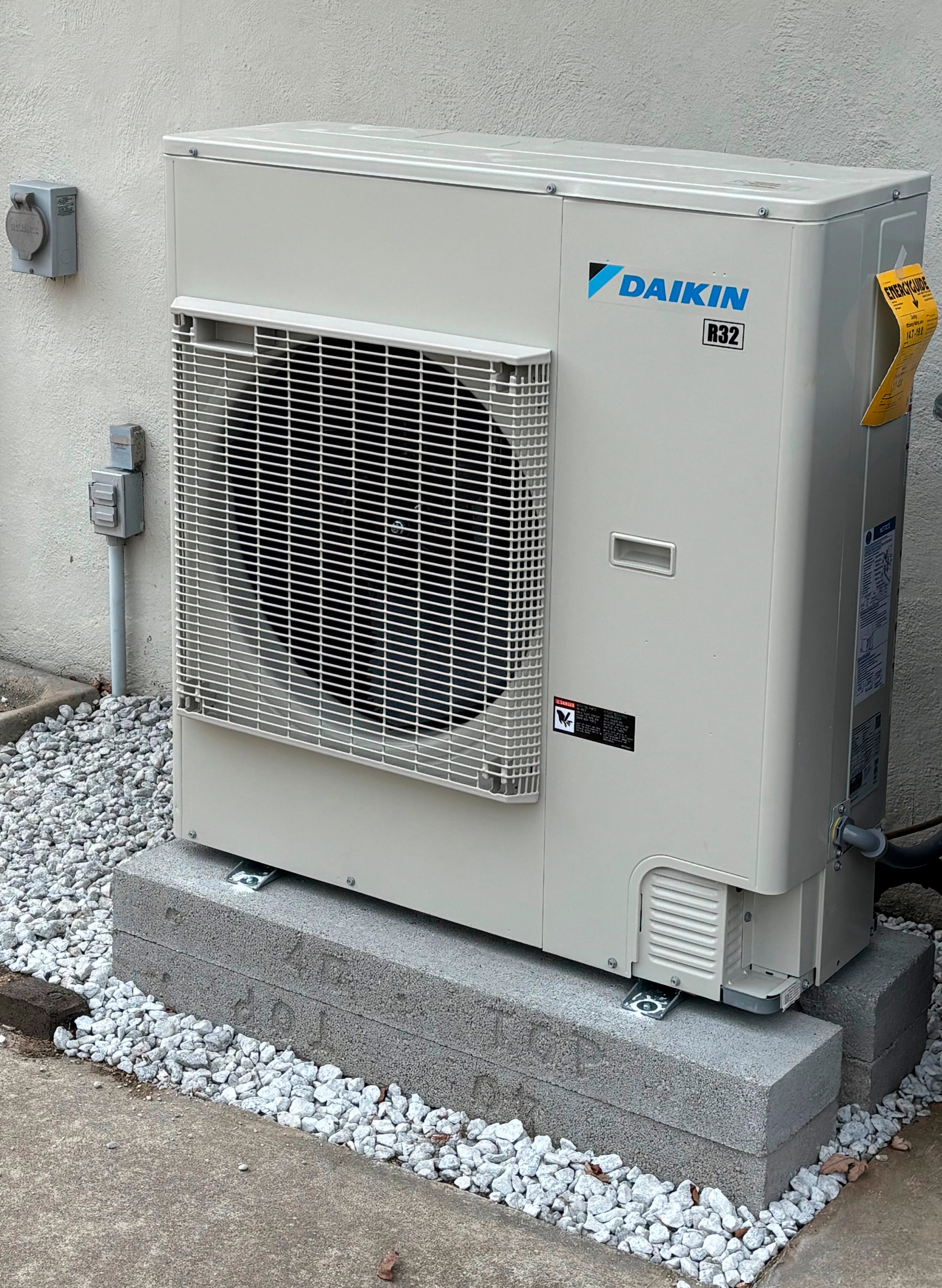 Daikin R32 outdoor air conditioning unit installed by Environmental Air Systems.