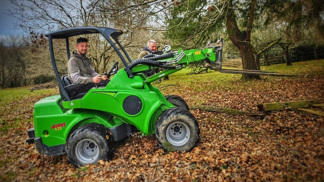 Green Leaves Fencing and Gates team operating machinery on site during a fencing project in West Sussex.