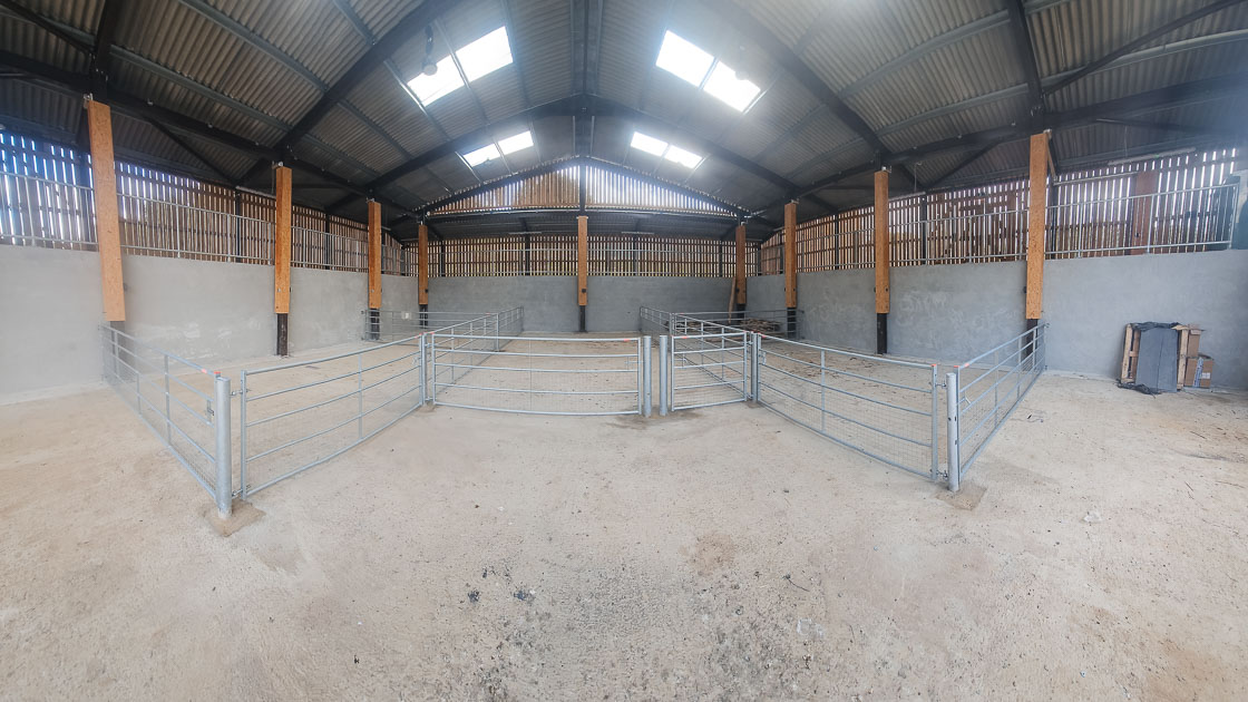 Internal view of a commercial fencing and gate installation with timber and steel framework by Green Leaves Fencing and Gates.