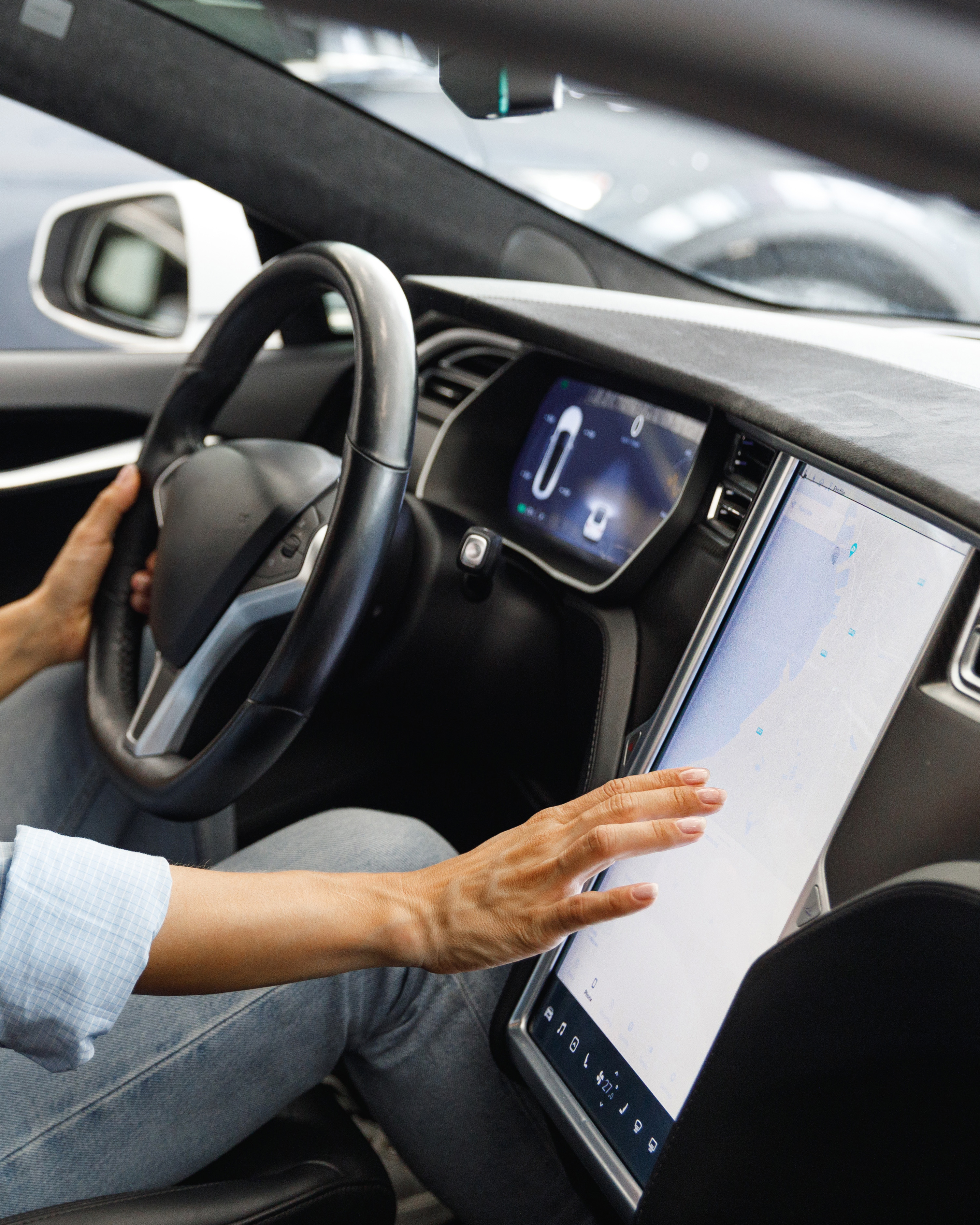 Woman driving a tesla