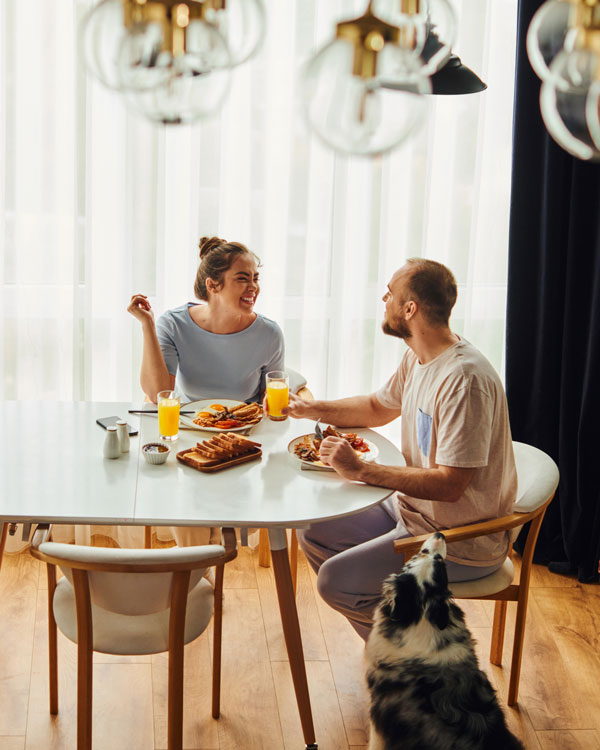 couple at table enjoying breakfast