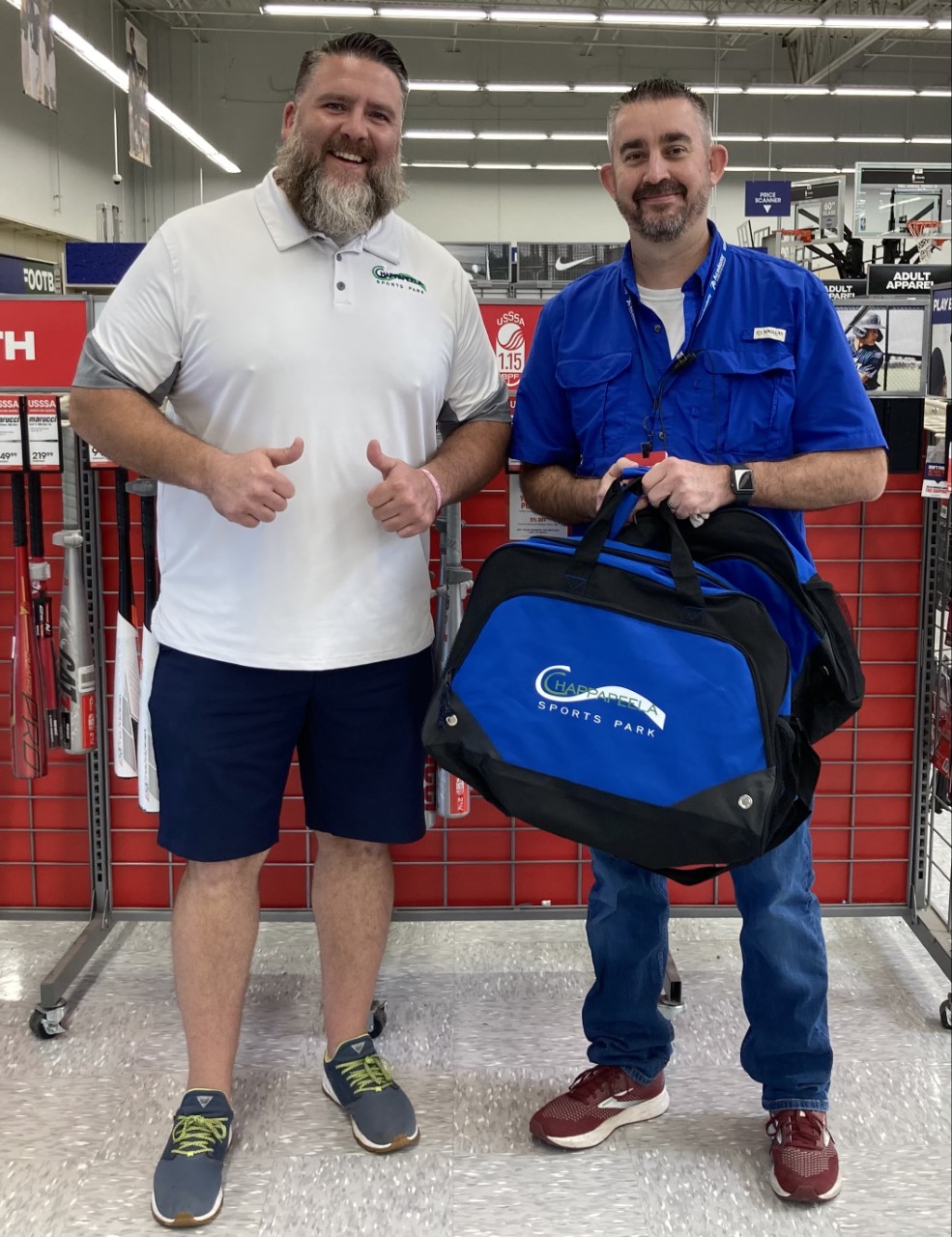 Ryan Barker, executive director of CSP and Danny Fletcher, manager of Academy Sports and Outdoors, Hammond.