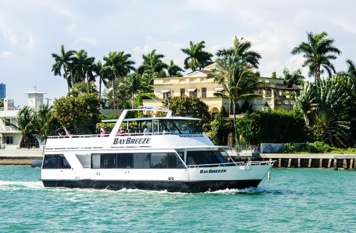 Cruise by a waterfront mansion