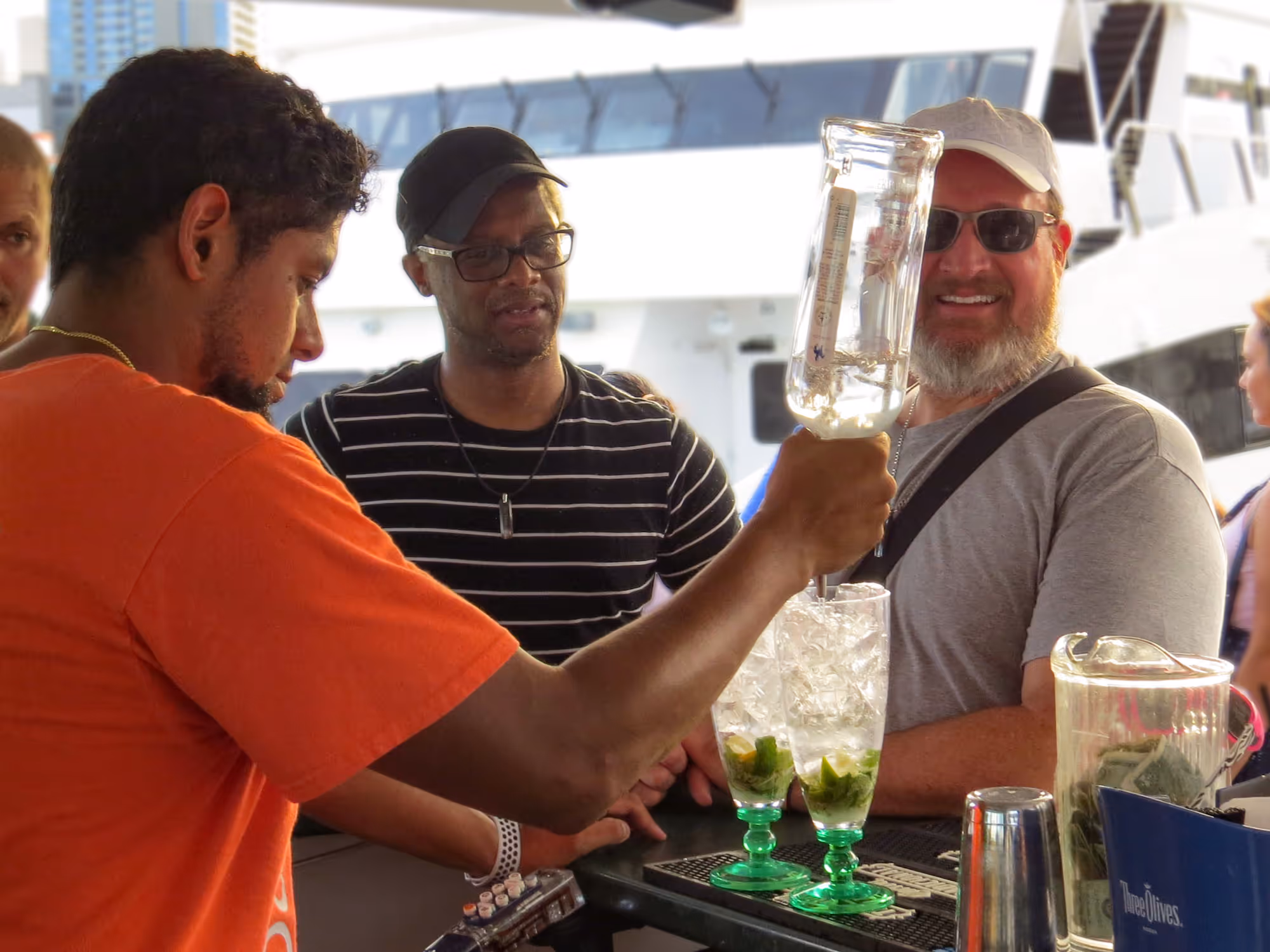 Bartender making a tropical drink onboard the tour boat