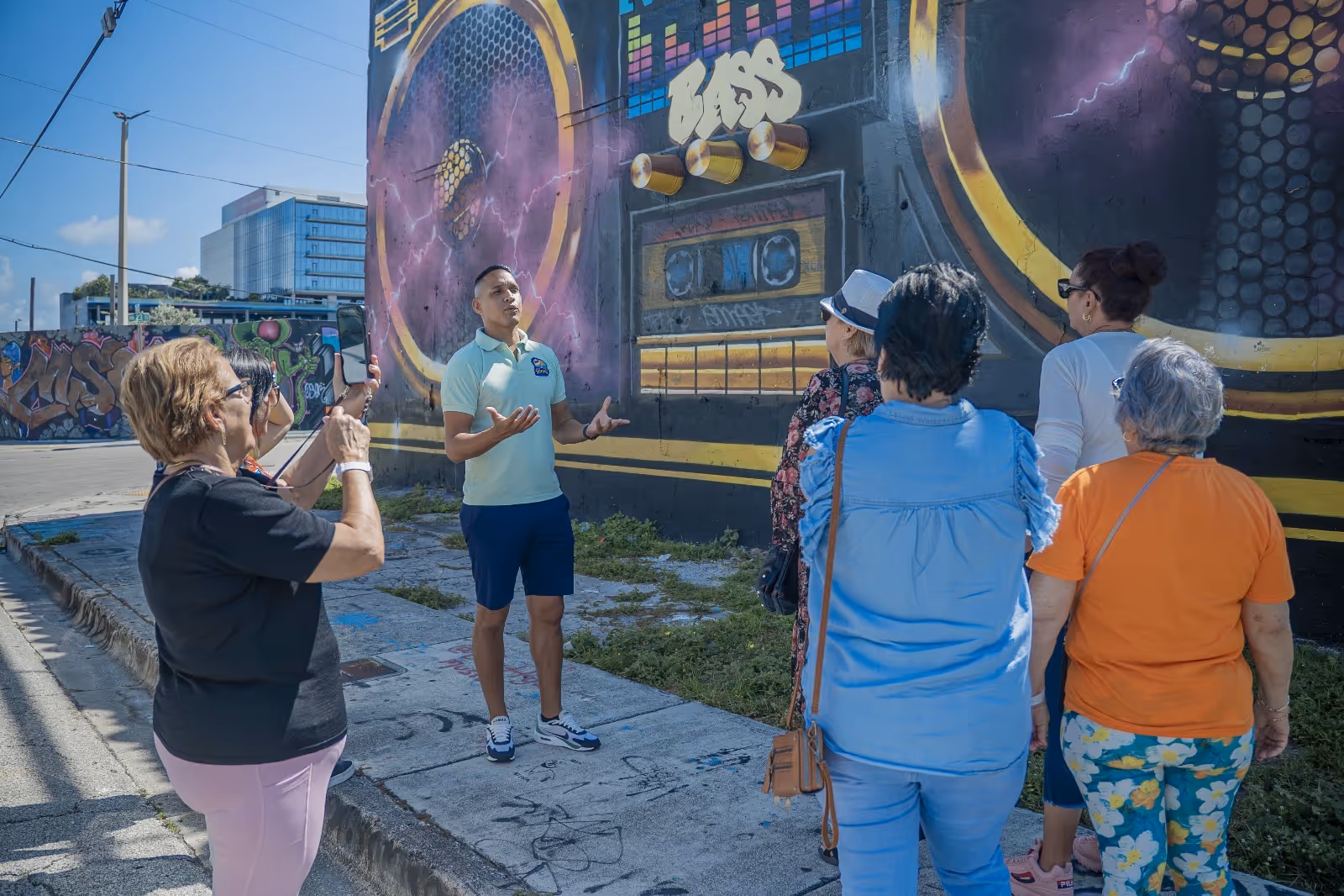Tour guide discussing the iconic boombox mural 
