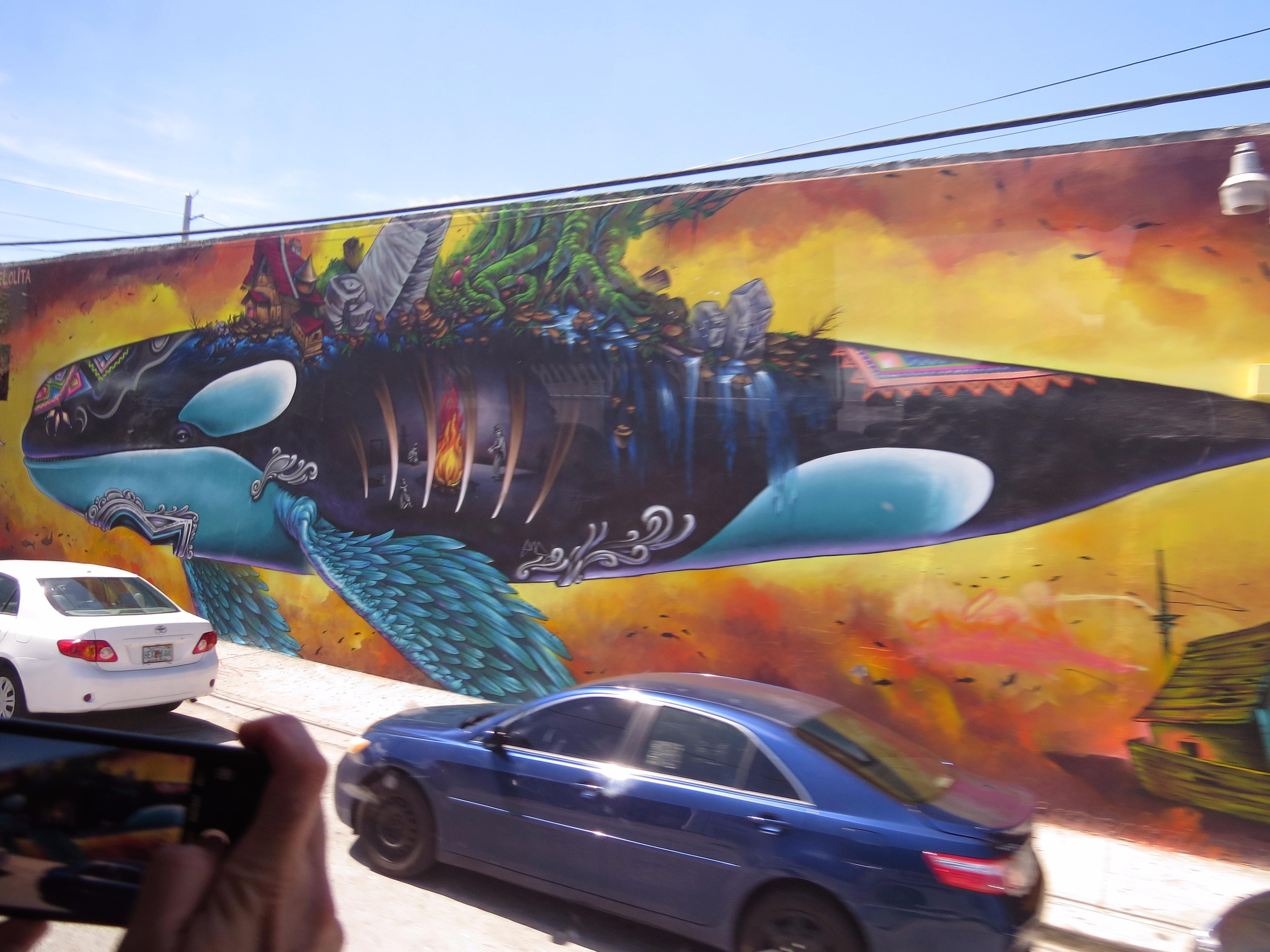 Photographing the killer whale mural from the tour van