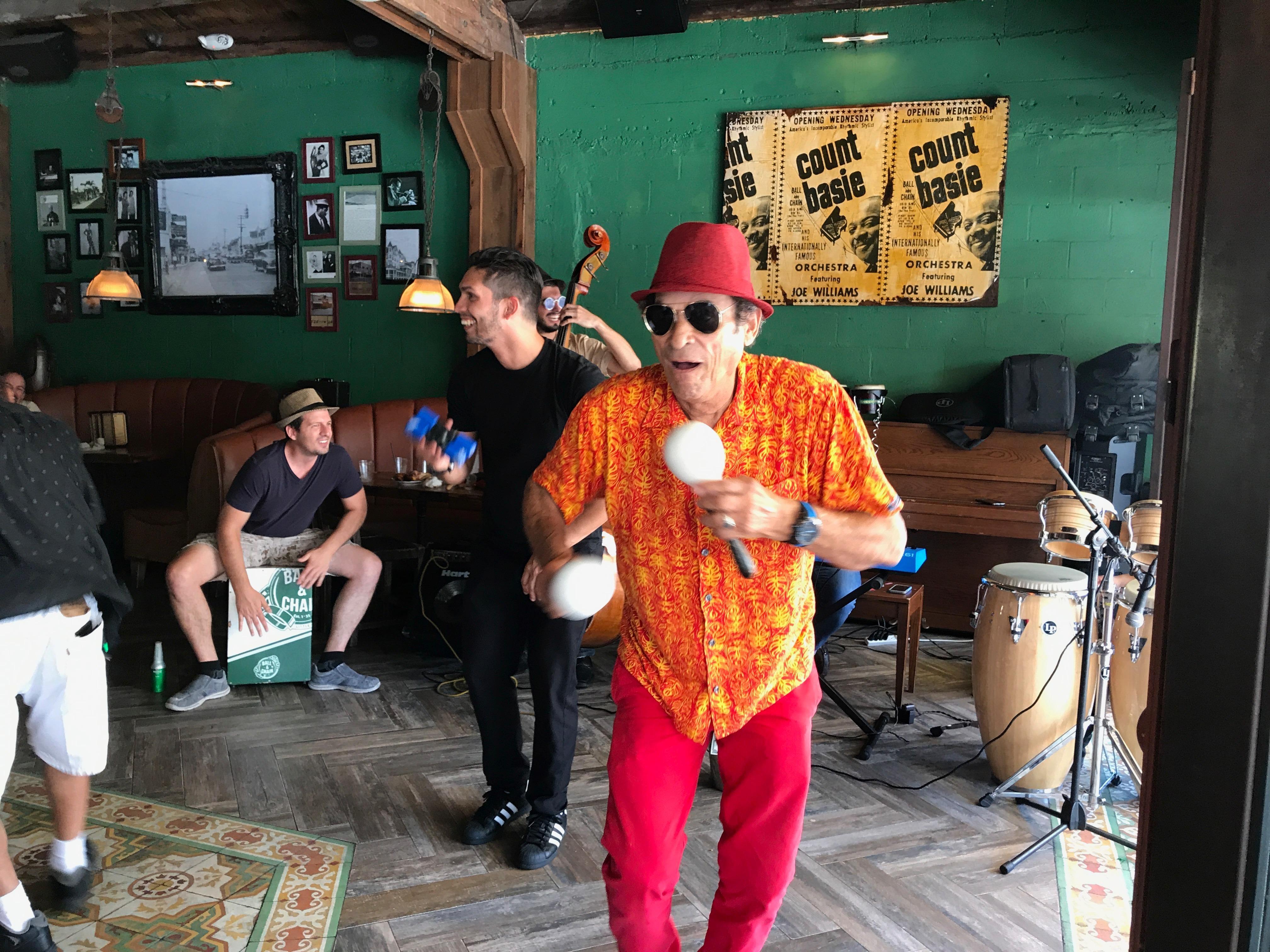 Colorfully dressed musicians performing at Ball & Chain nightclub in Miami