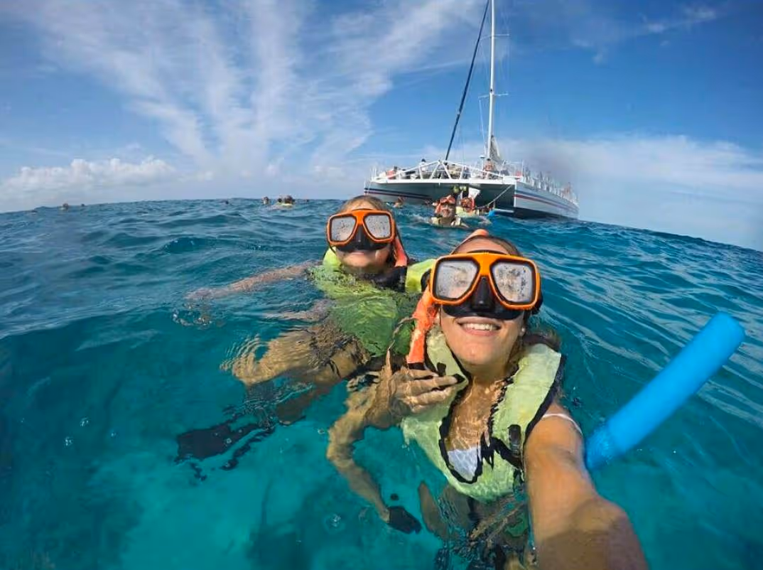 Taking a selfie treading water in front of the boat