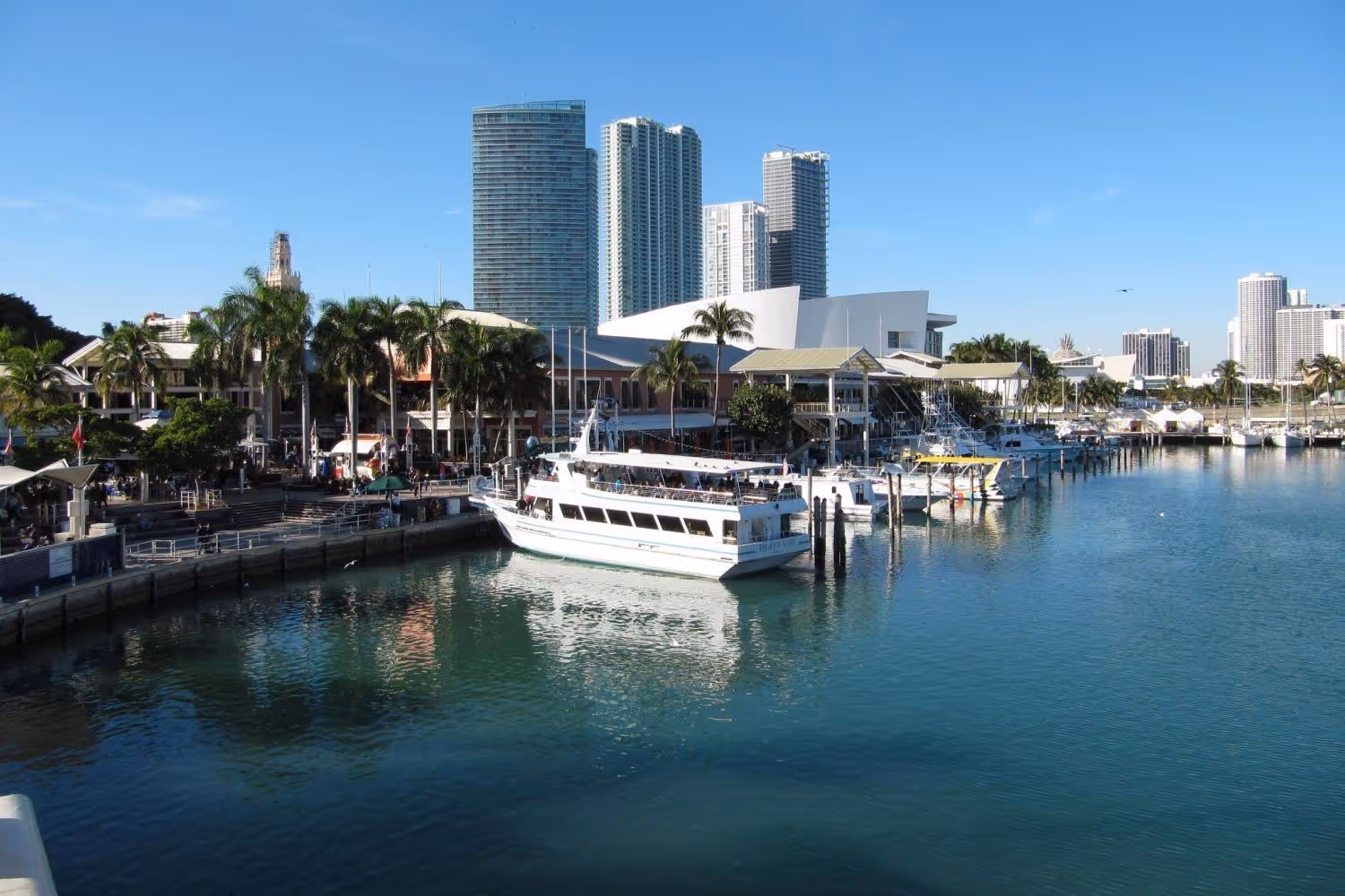 Tour boats docked at the at Bayside Marina on a sunny day