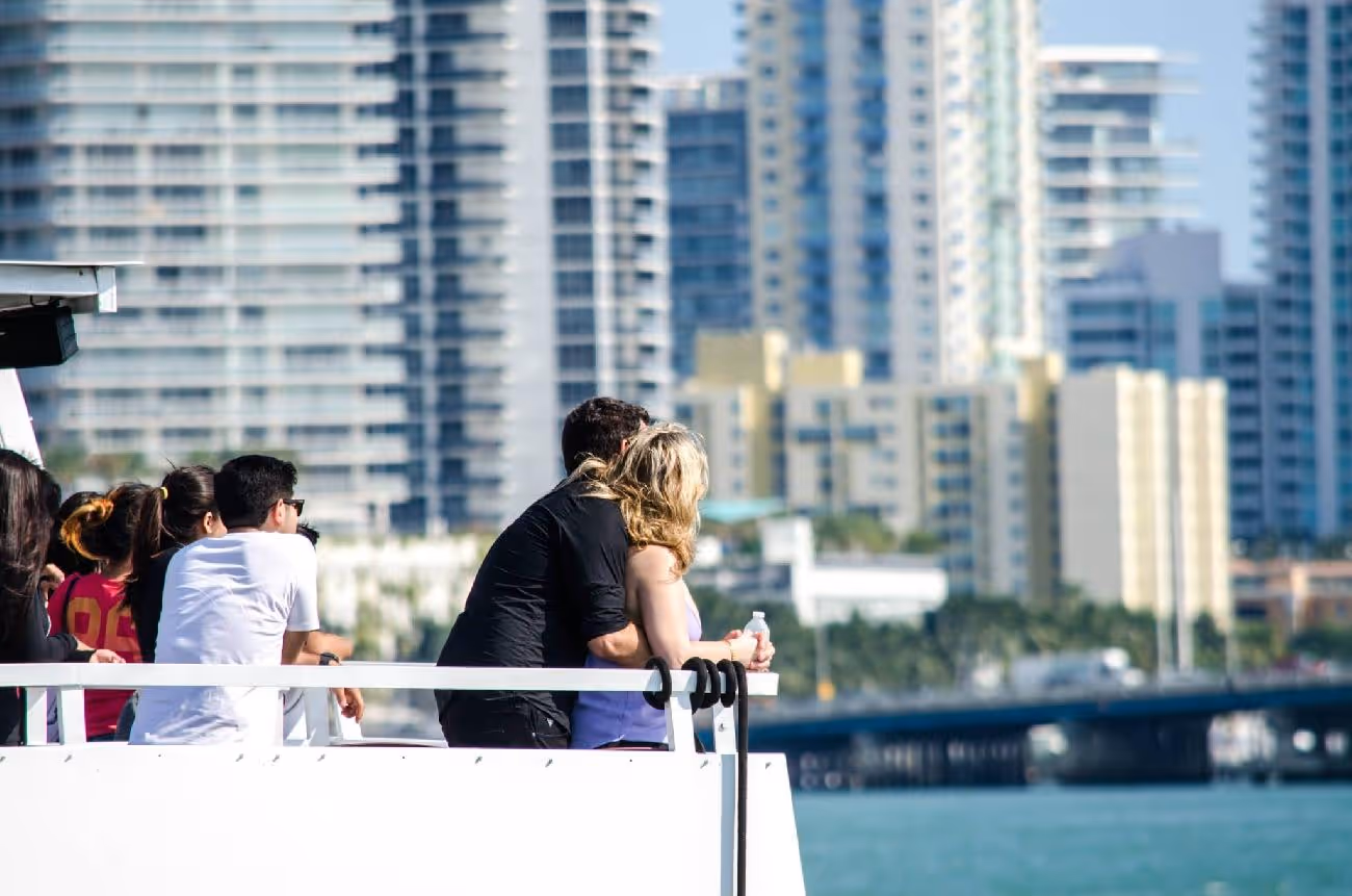 Young lovers enjoying a romantic view of Miami skyline