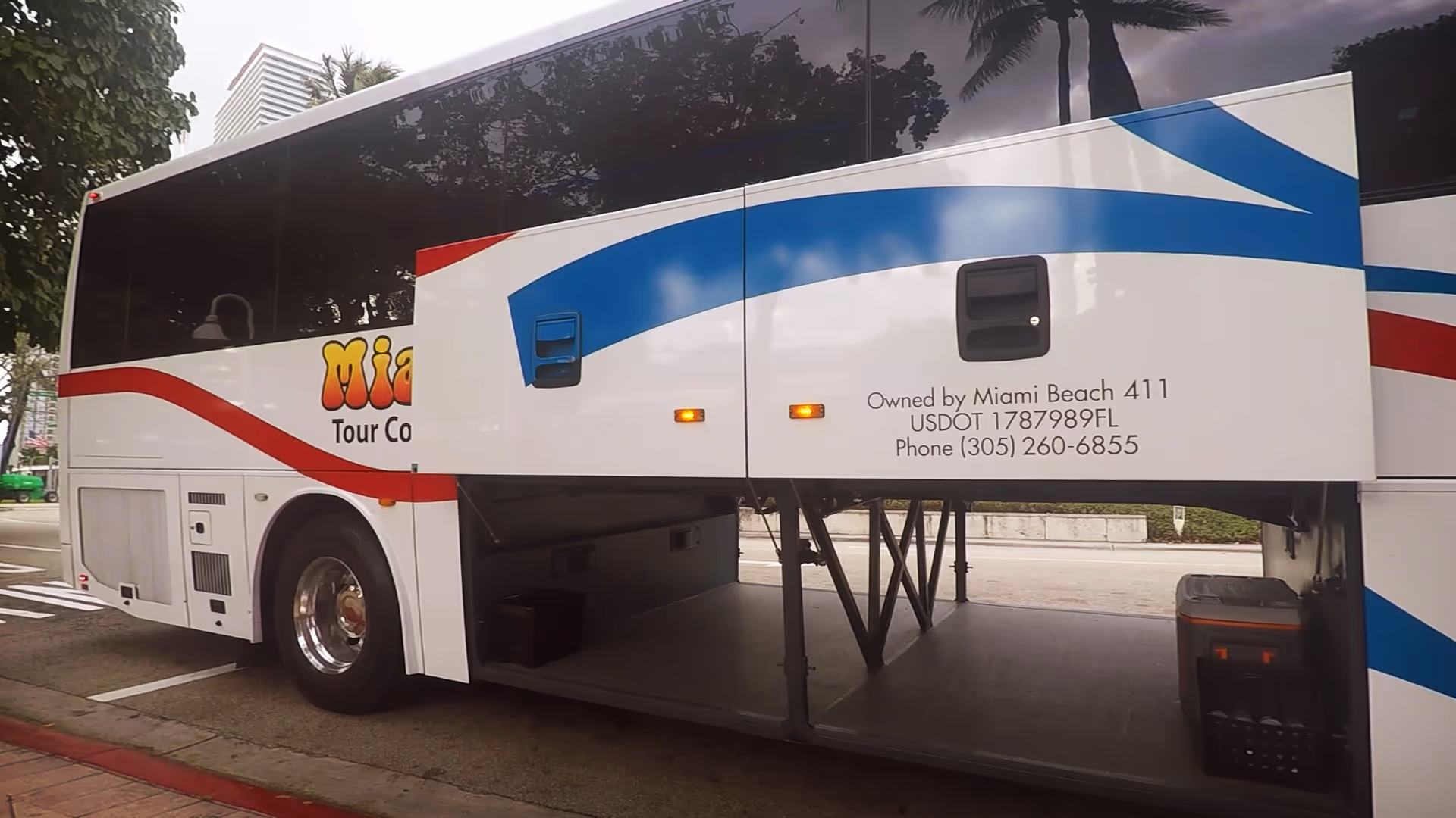 An open lhe luggage bay door of our charter bus