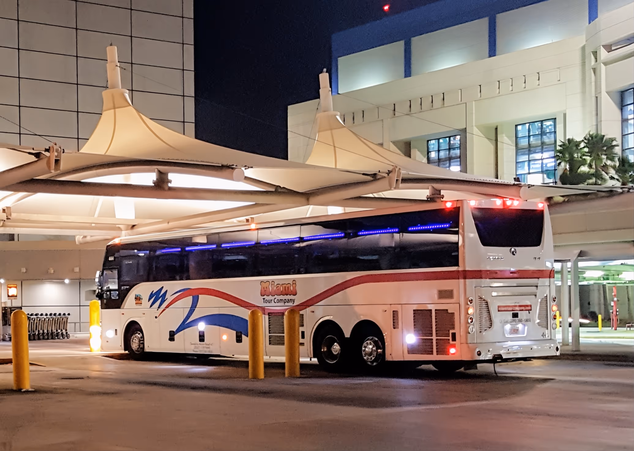 Motorcoach bus parked at Miami Airport at night