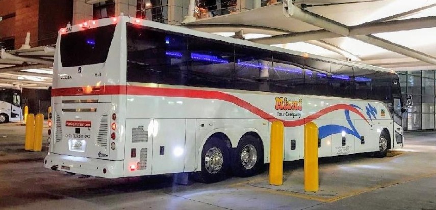 Motorcoach bus parked at Fort Lauderdale Airport at night