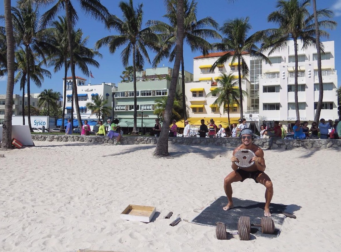 Athletic locals working out on the sand at Muscle Beach on Ocean Drive