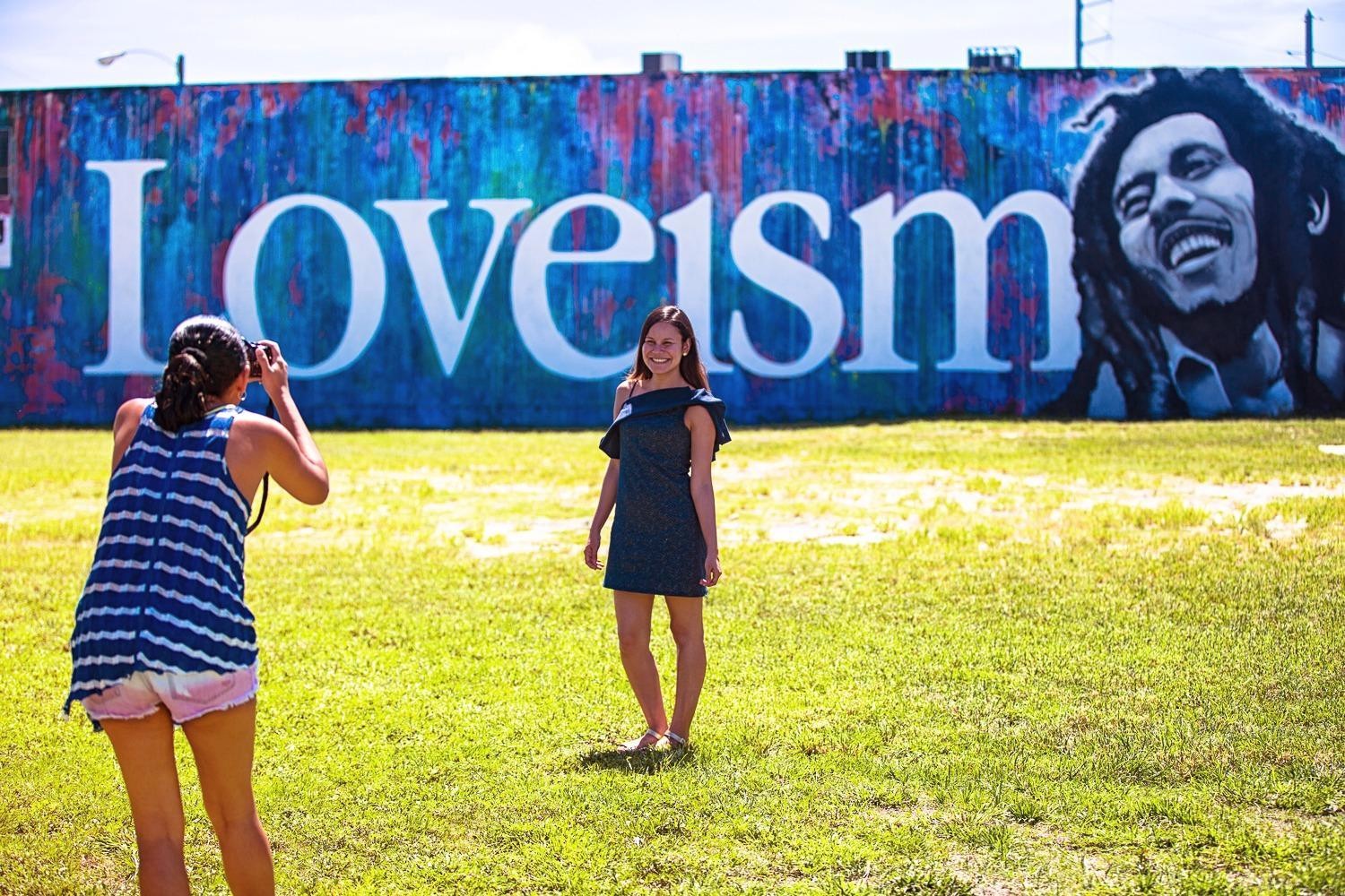 Young lady posing near the Loveism Bob Marley mural in Wynwood